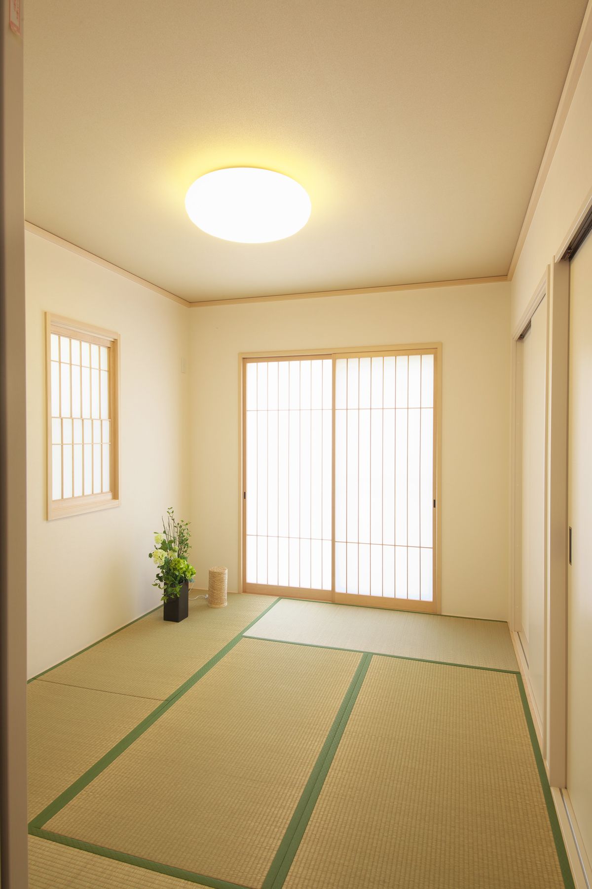 Elegant traditional Japanese tatami room with wooden sliding doors and shoji screens