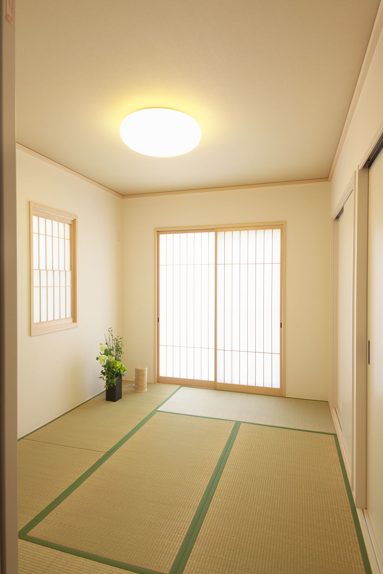 Japanese-style room with tatami mats and wooden sliding shoji doors
