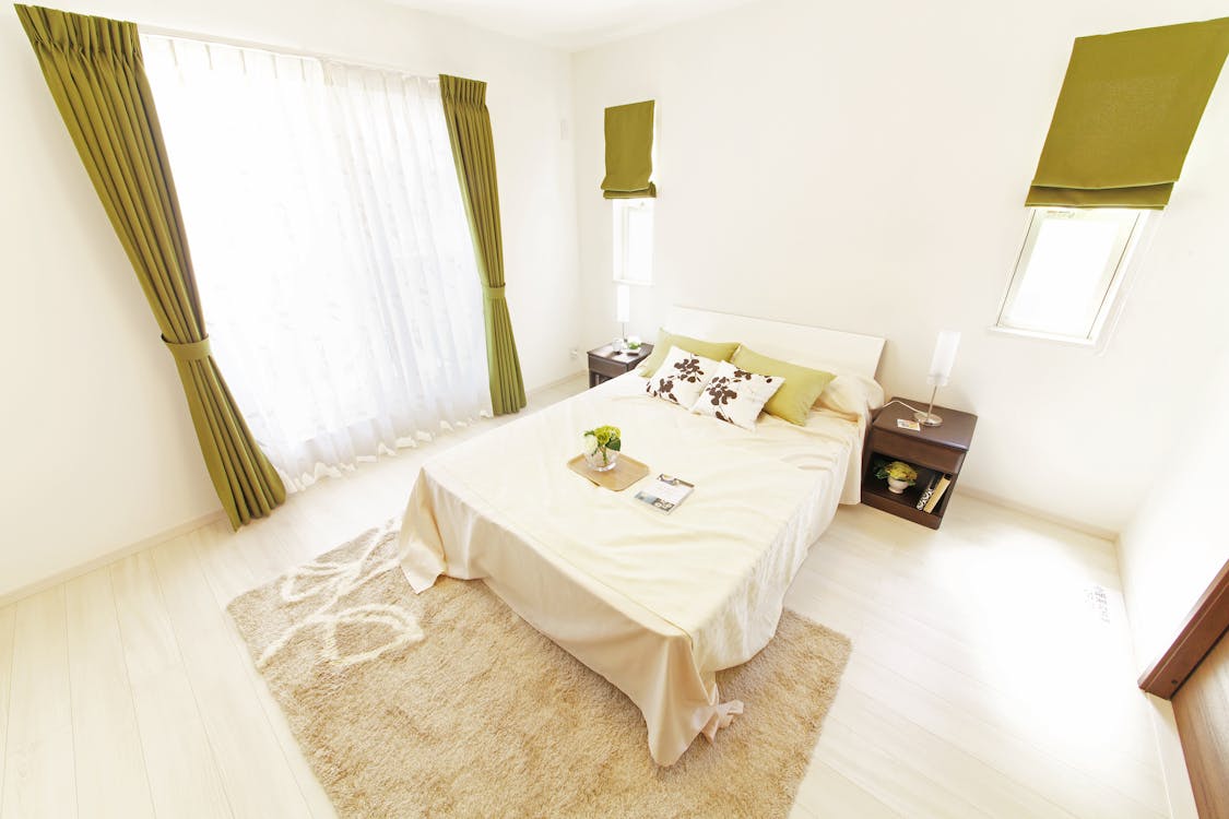 Free Beige Bedding Set Near Curtain Stock Photo