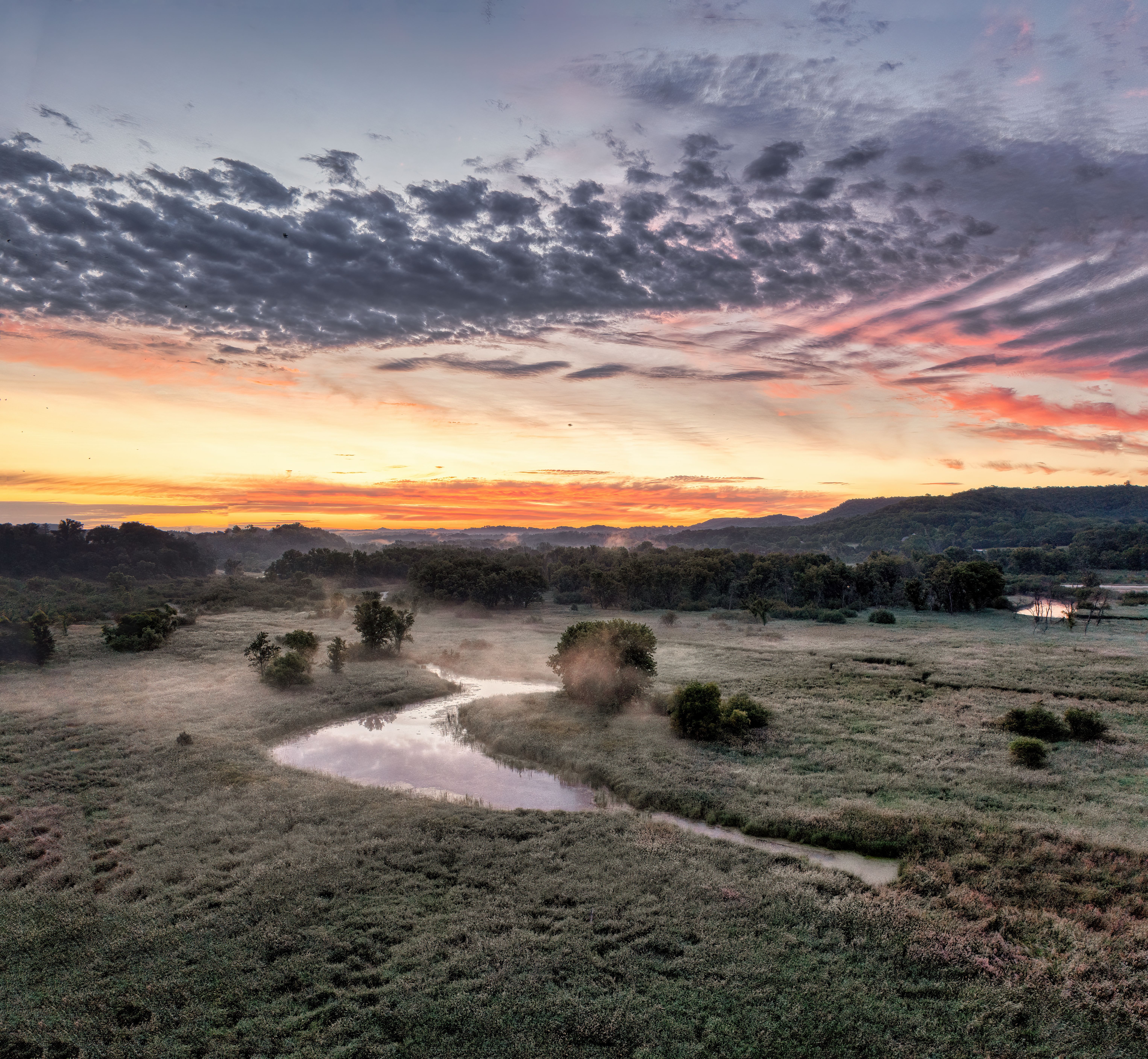 Sunset over the plains and river in the morning · Free Stock Photo