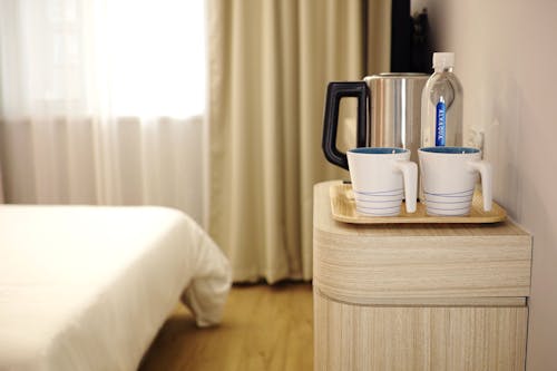 Two White Ceramic Mug on Brown Wooden Tray