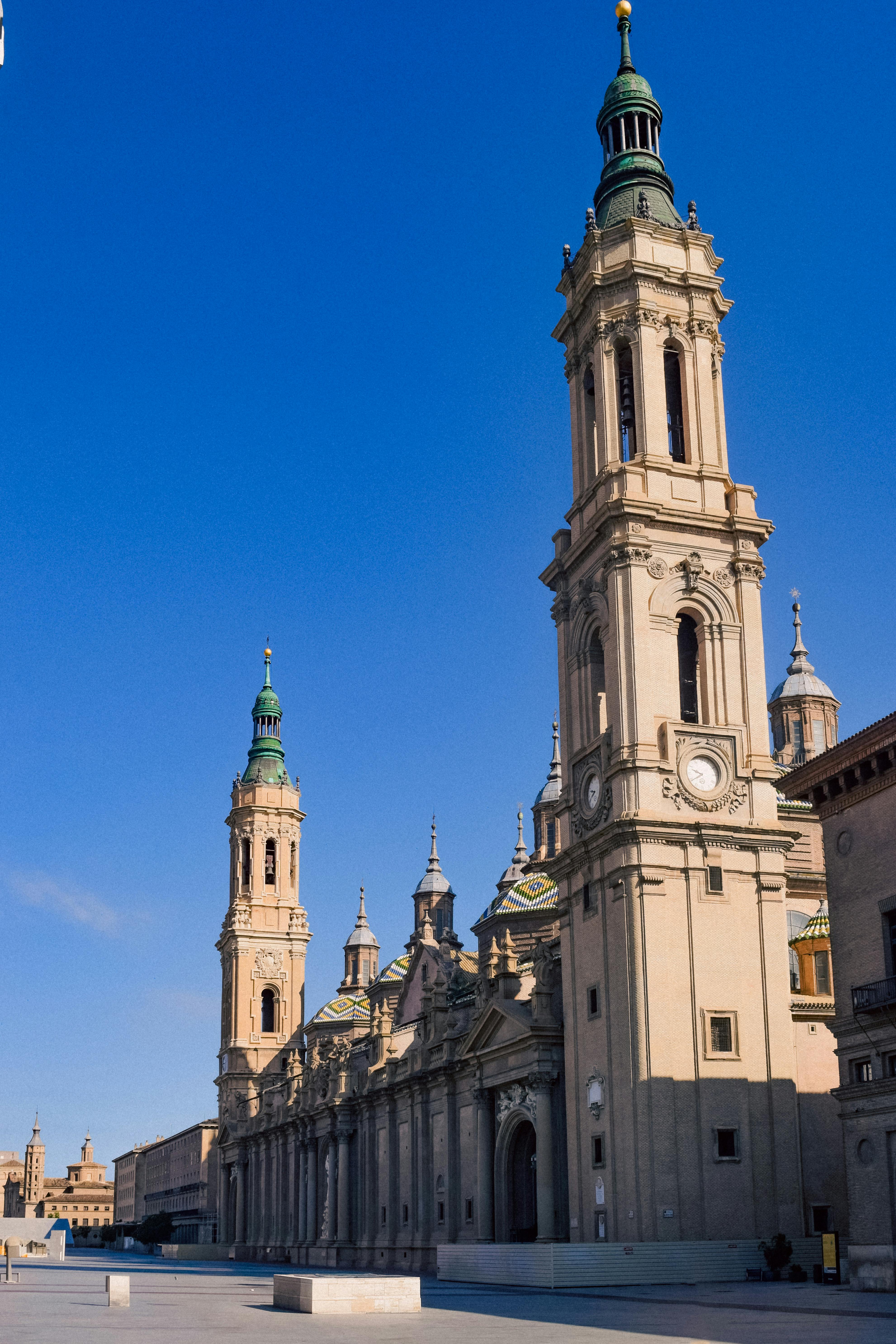 Discover the breathtaking architecture of Basilica de Nuestra Señora del Pilar in Zaragoza against a clear blue sky.