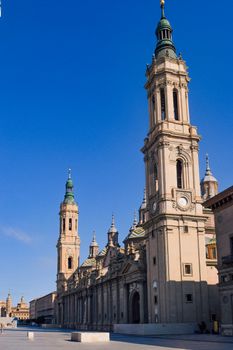 Discover the breathtaking architecture of Basilica de Nuestra Señora del Pilar in Zaragoza against a clear blue sky.