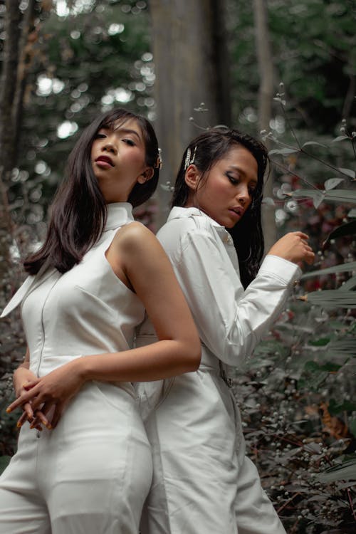 Free Two Women Wearing White Jumpsuits Stock Photo