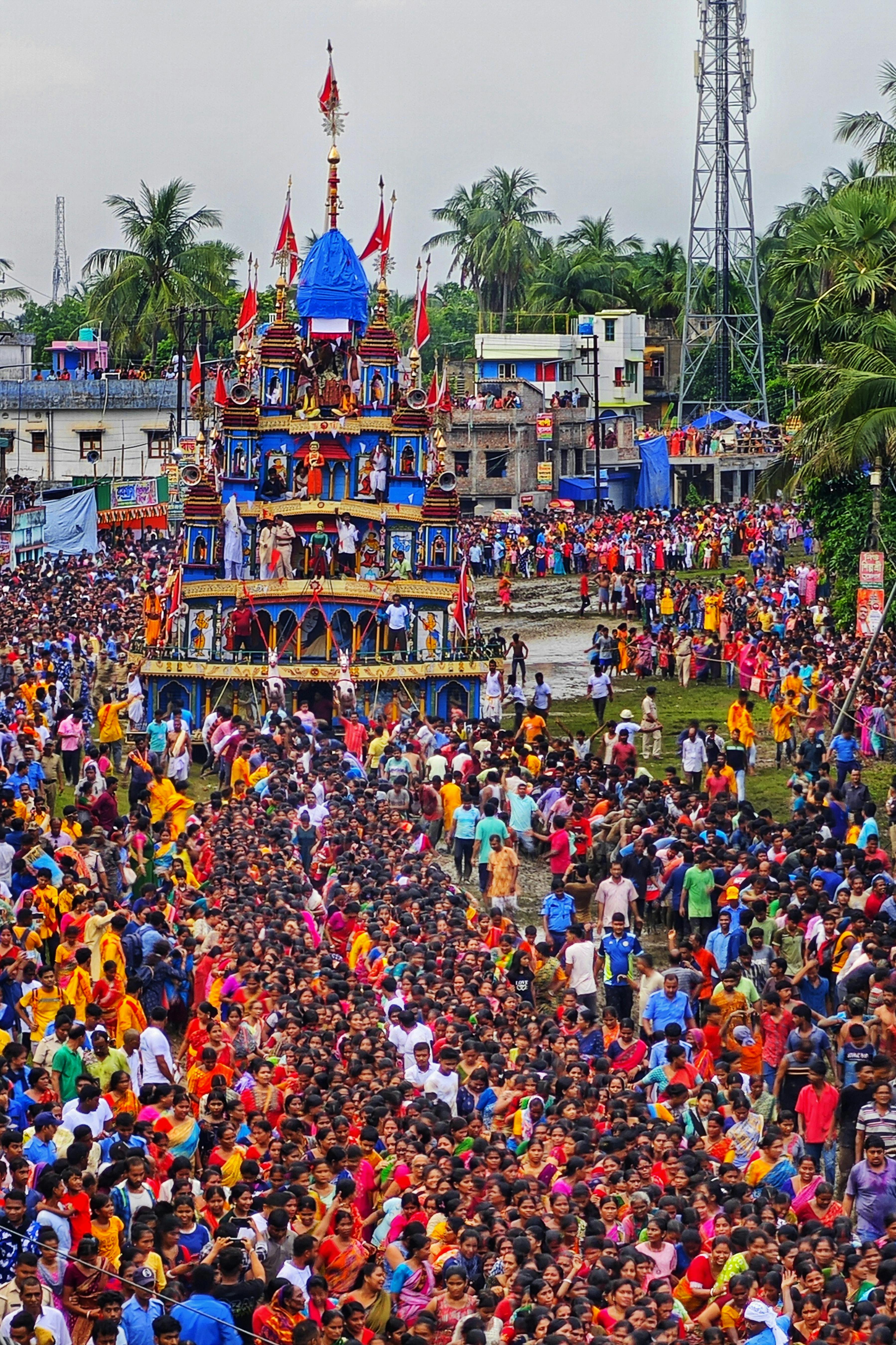 Colorful crowd celebrating Rath Yatra festival in Mahishadal, West Bengal, India.