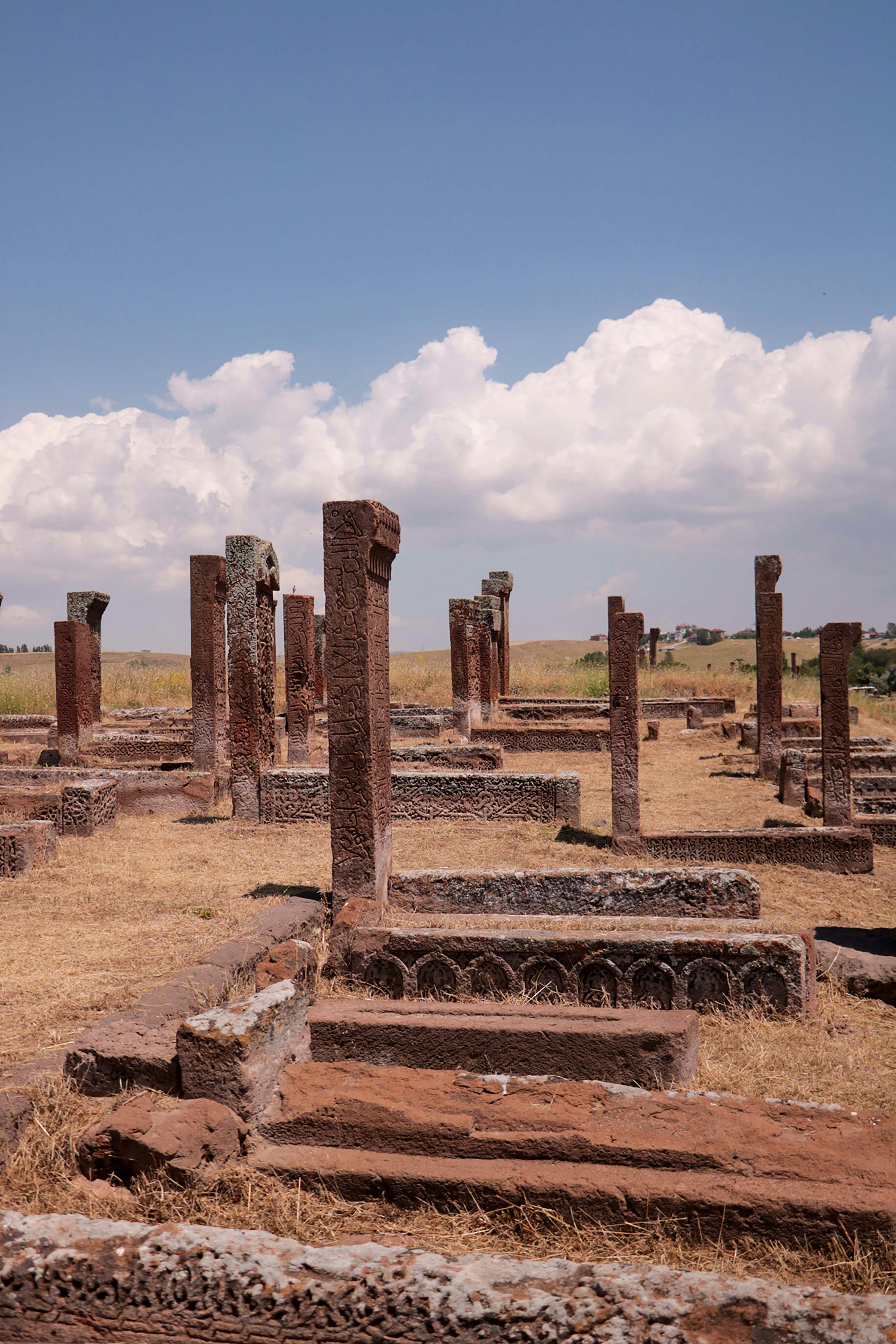 The ruins of a temple in the middle of a field