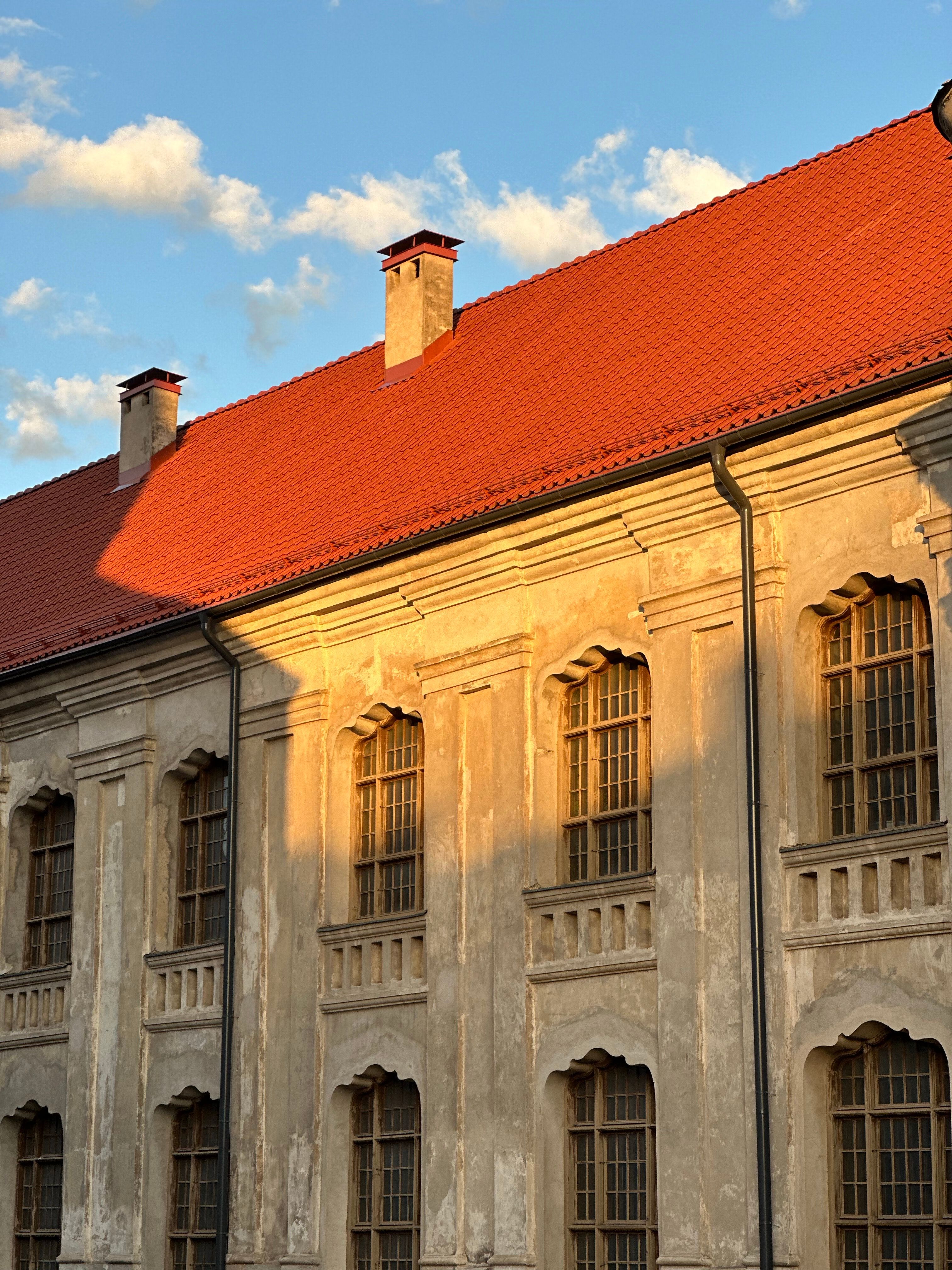 A building with red roof and windows · Free Stock Photo
