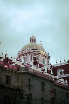 Beautiful view of a historic church dome in Puebla, Mexico showcasing intricate architecture.