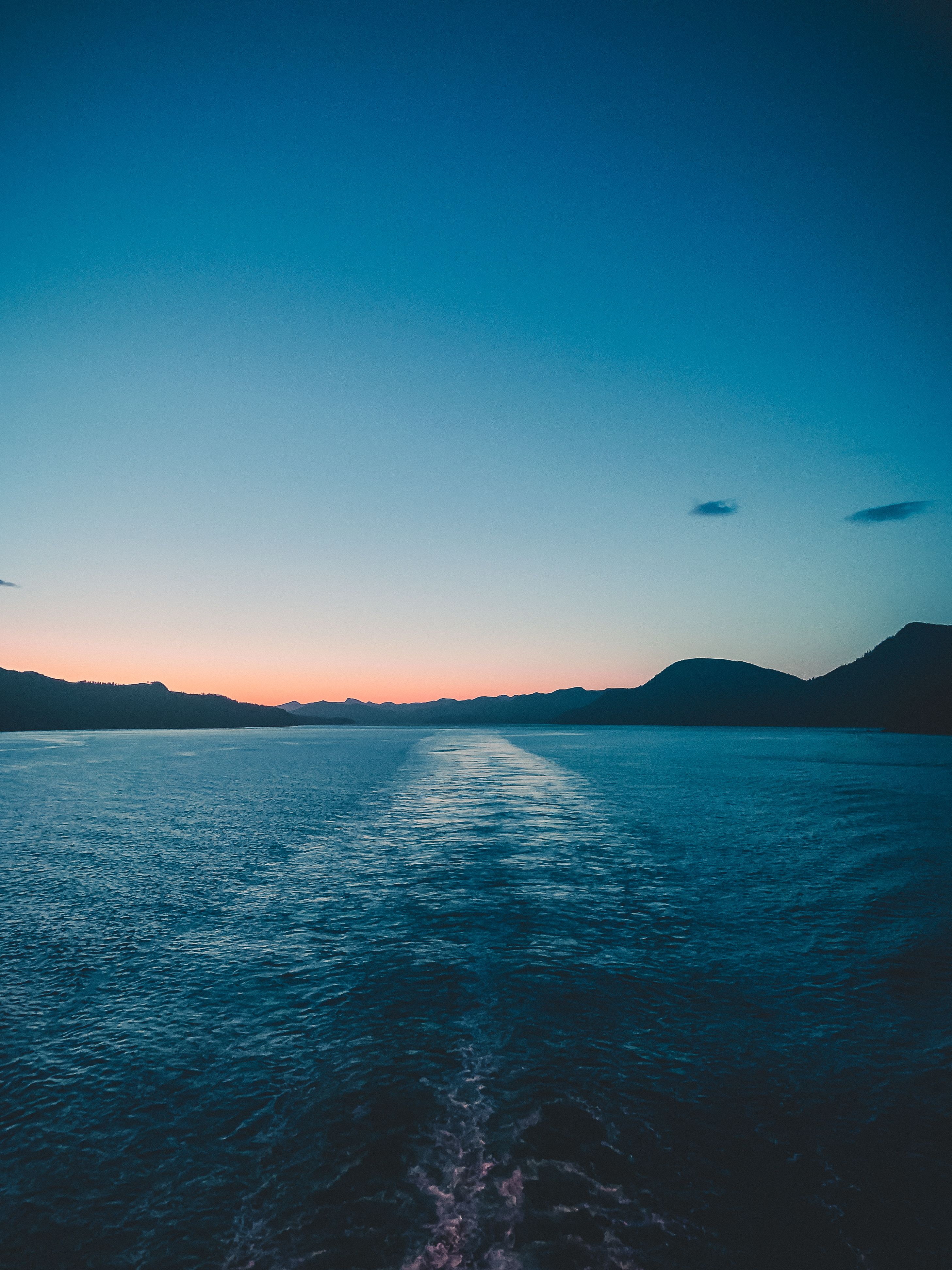 Clear Sky over Sea Coast at Sunset · Free Stock Photo