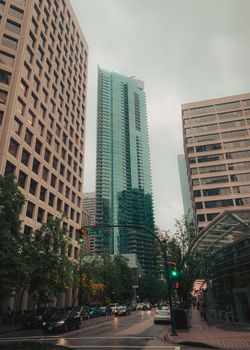 Vancouver downtown cityscape with modern skyscrapers under a cloudy sky. Urban architecture scene.