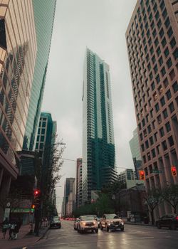 Captivating view of Vancouver's downtown with tall skyscrapers and busy street traffic.