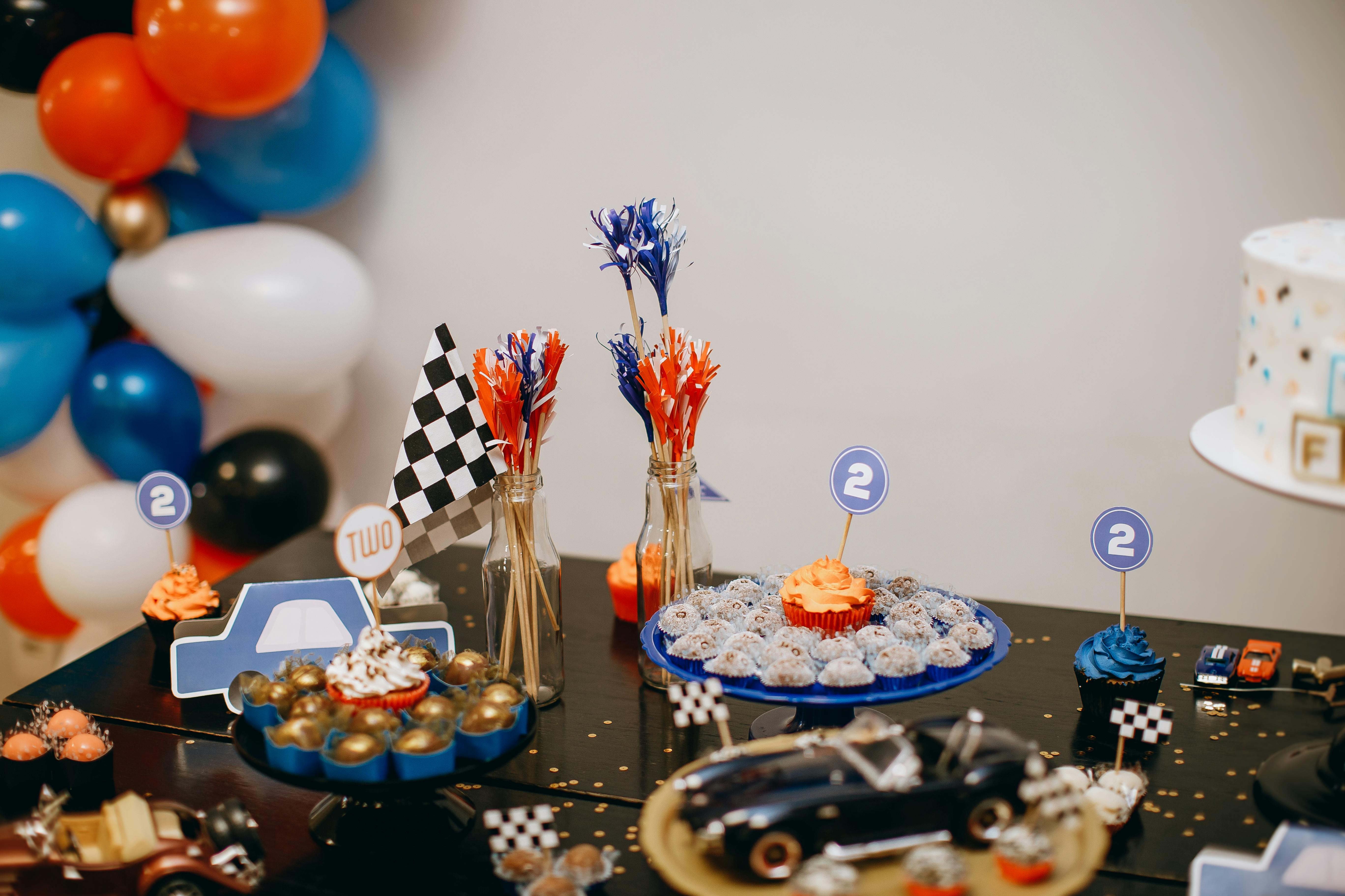 racing car theme birthday table with snacks and cake