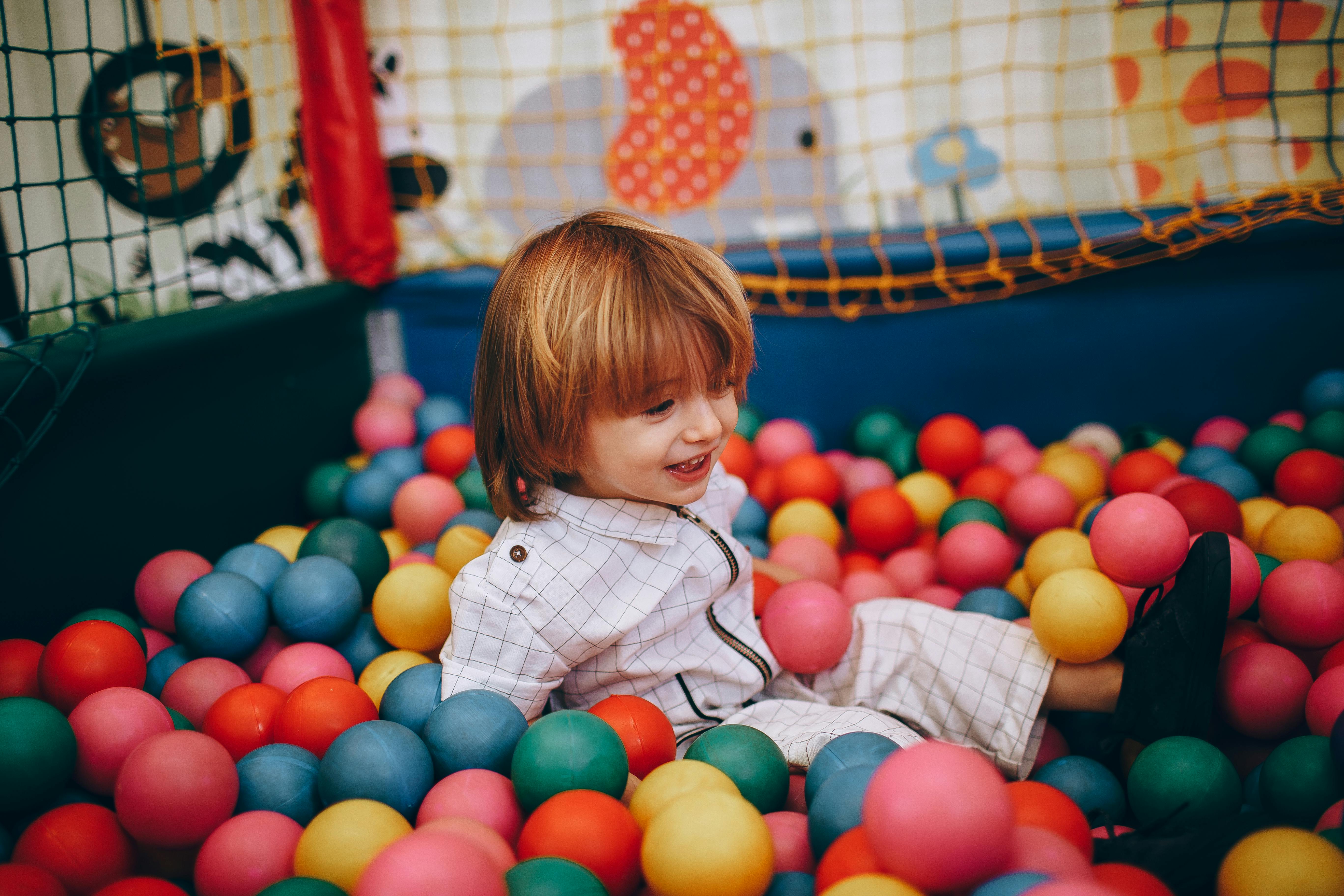 kid in a ball pit