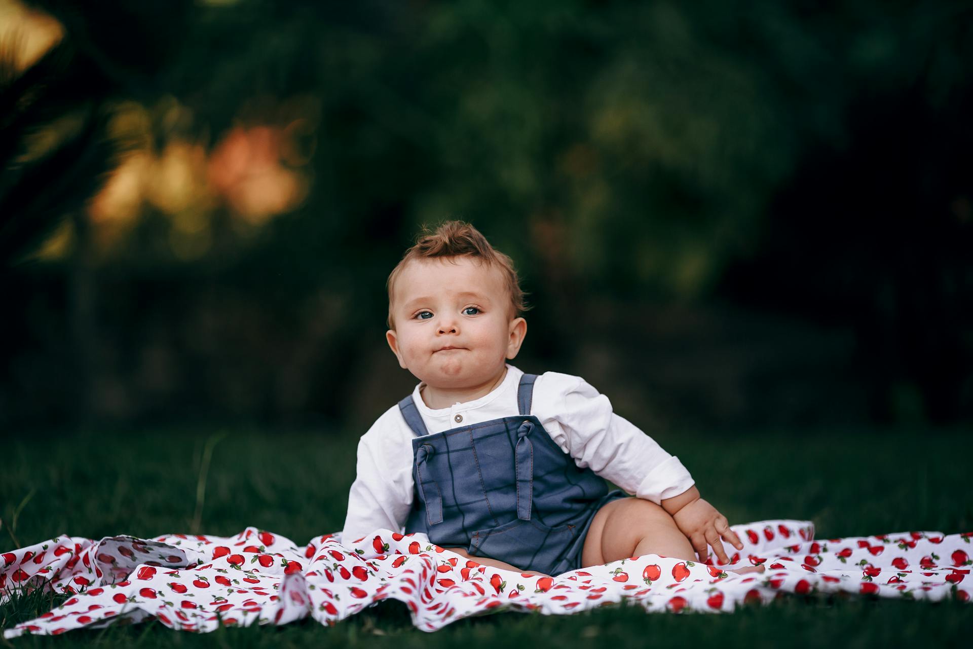 Baby Boy Sitting on a Blanket