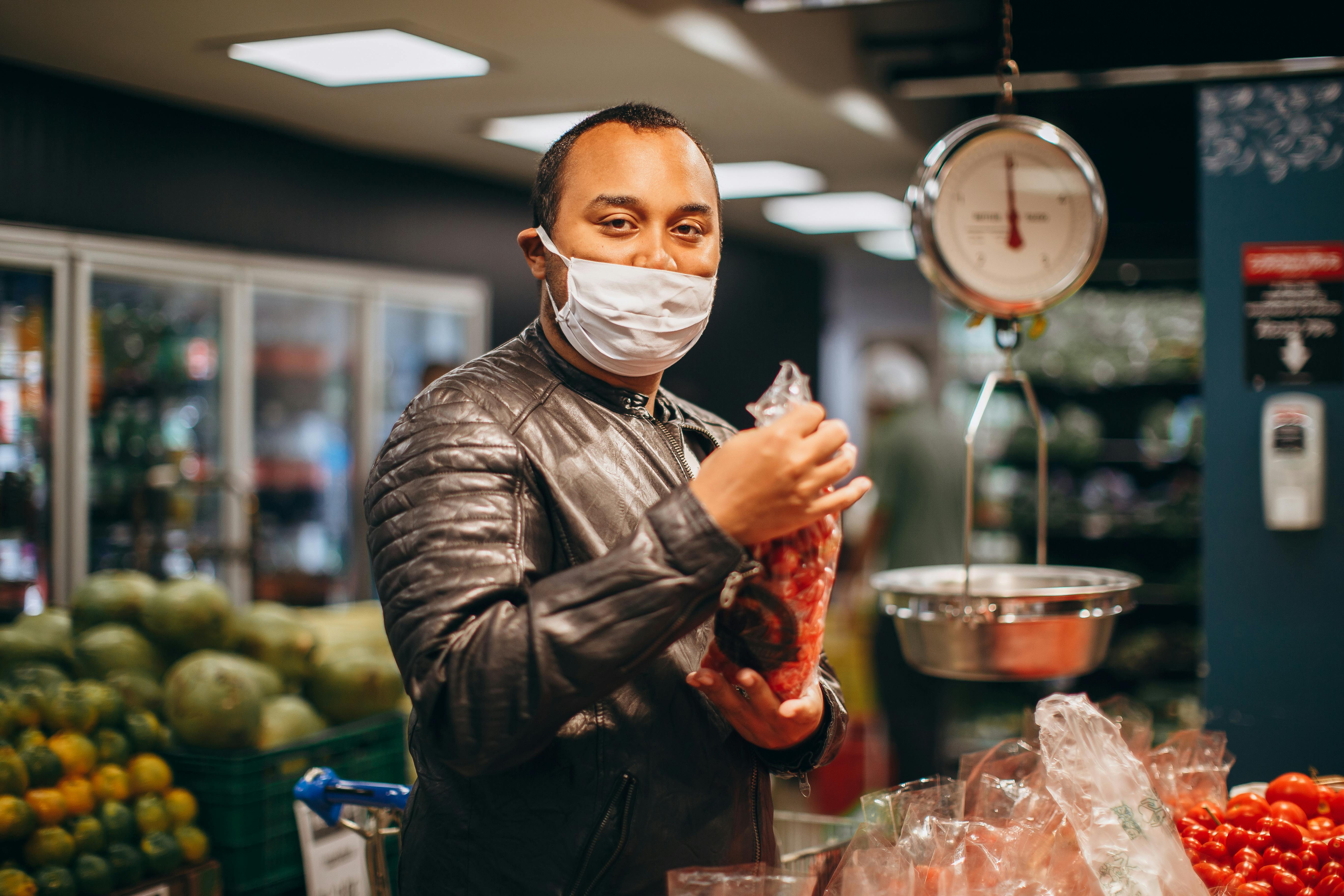 A man wearing a face mask in a supermarket