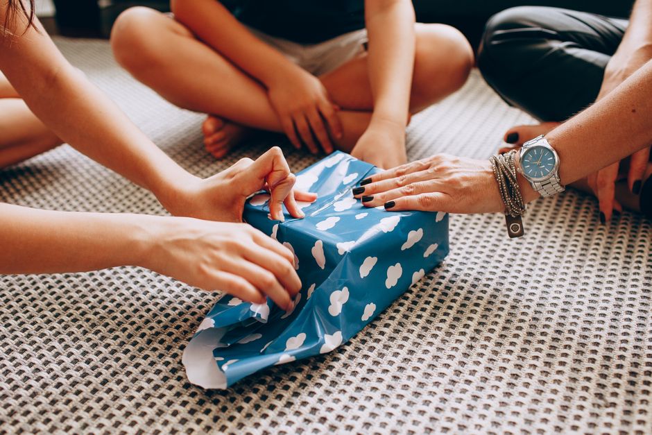family unwrapping gift certificate glamping experience