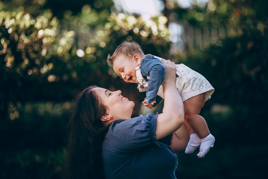 A happy, healthy new mother holding her baby - pregnancy fitness classes near me A happy, healthy new mother holding her baby - pregnancy fitness classes near me