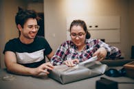 Couple Unpacking Package