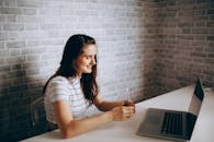 Woman Having a Meeting on Laptop