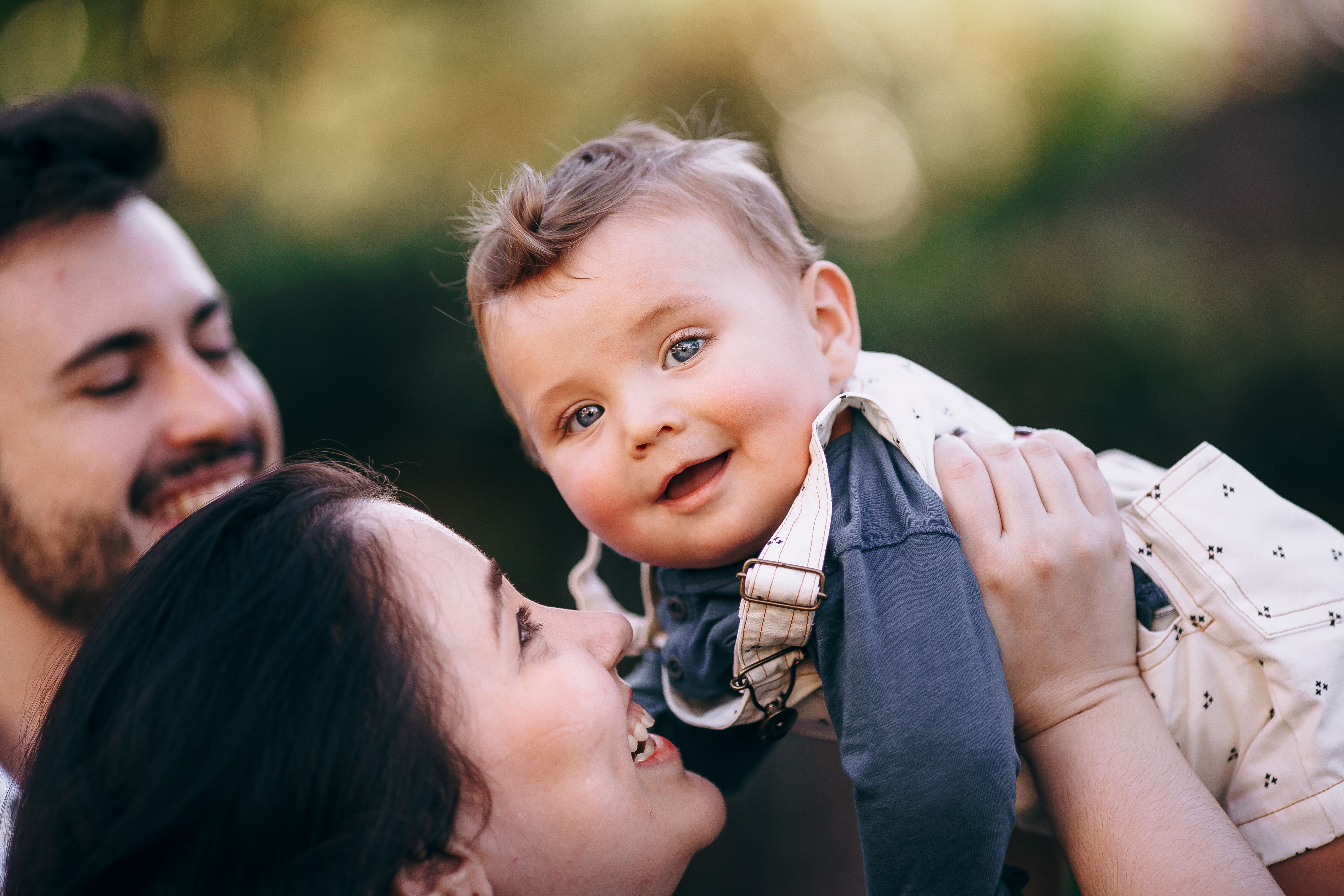 Happy Family Bonding in Outdoor Setting · Free Stock Photo
