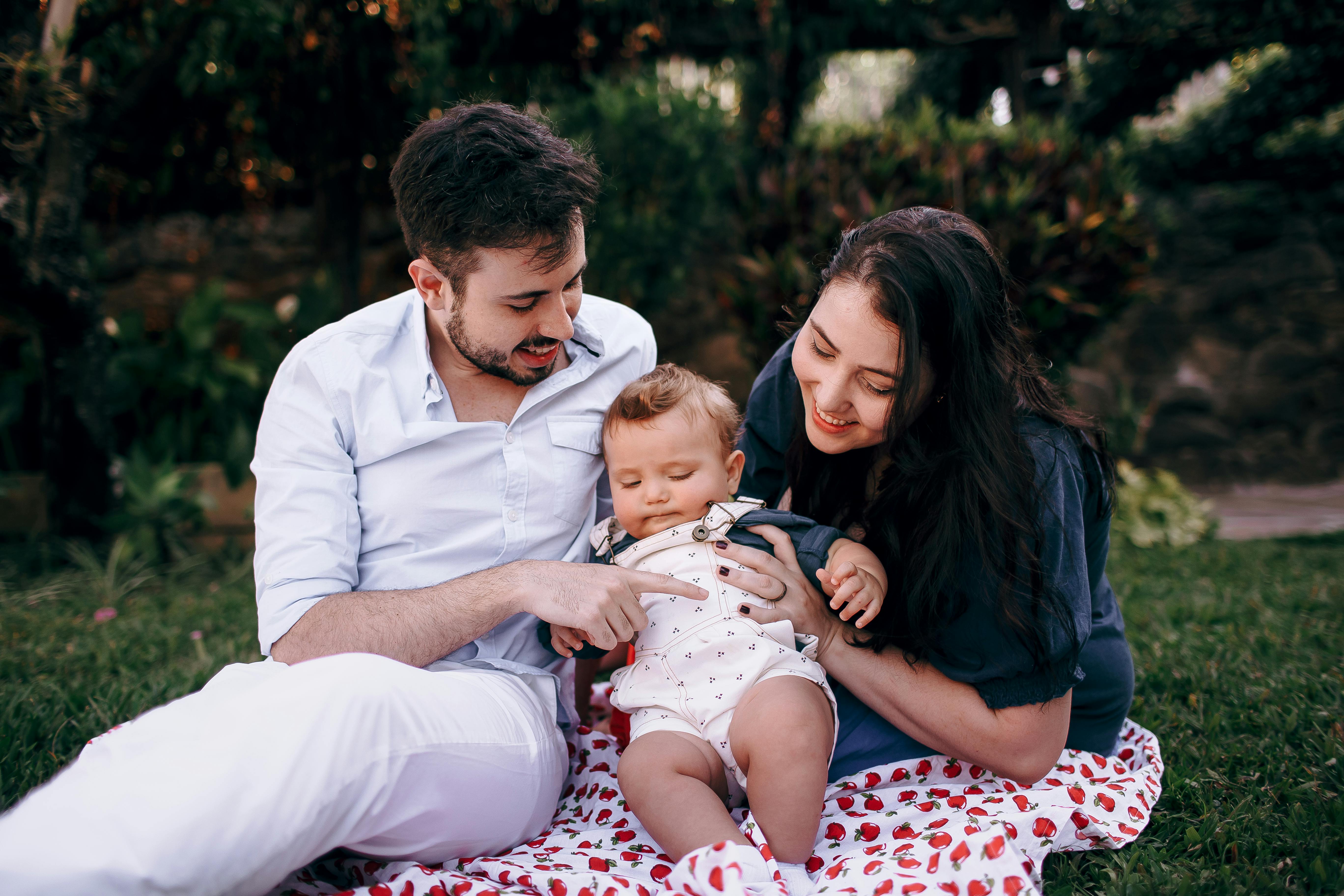 A joyful family enjoying quality time together during a picnic in the park.