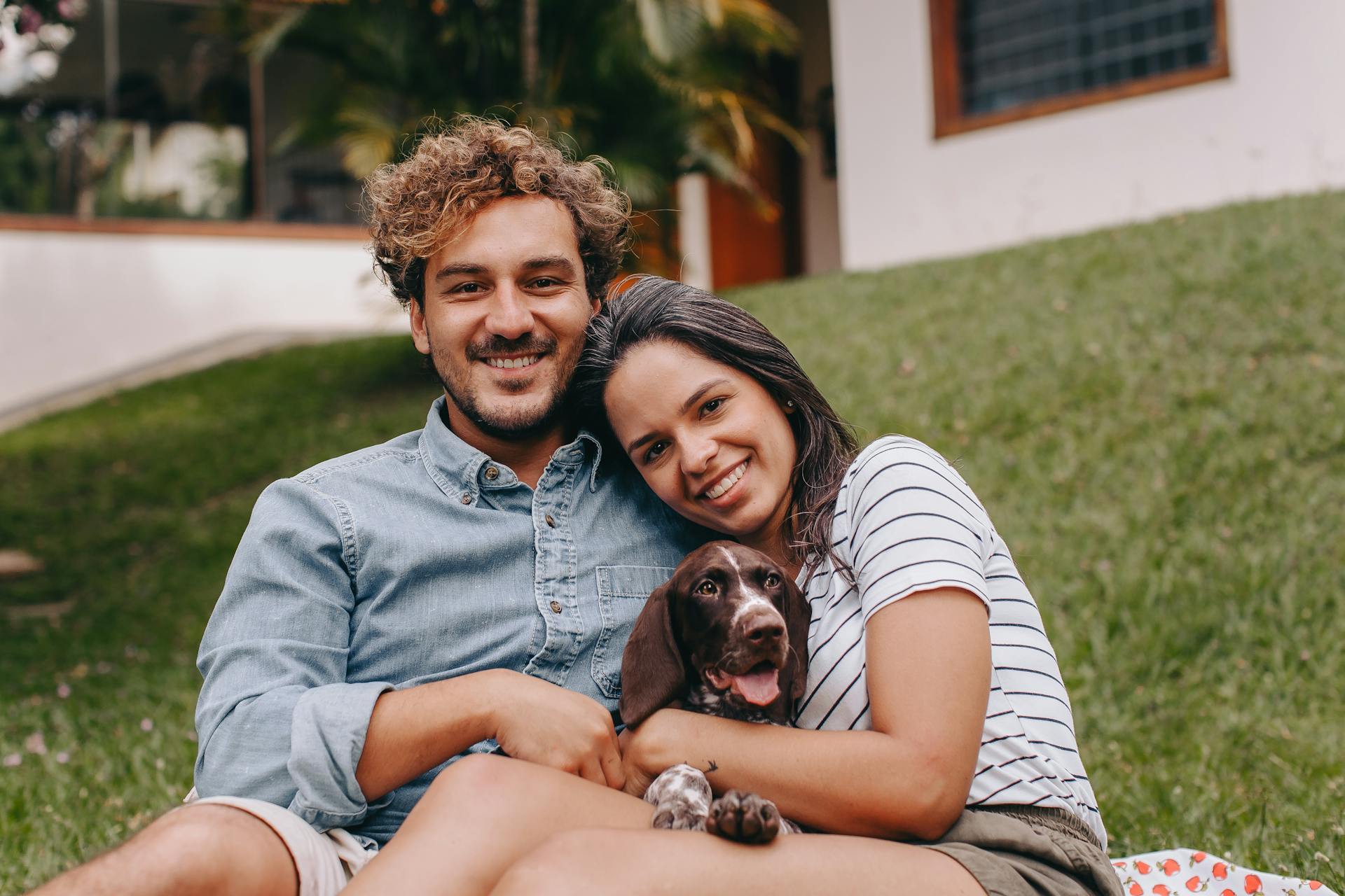 Portrait of Smiling Couple with Dog