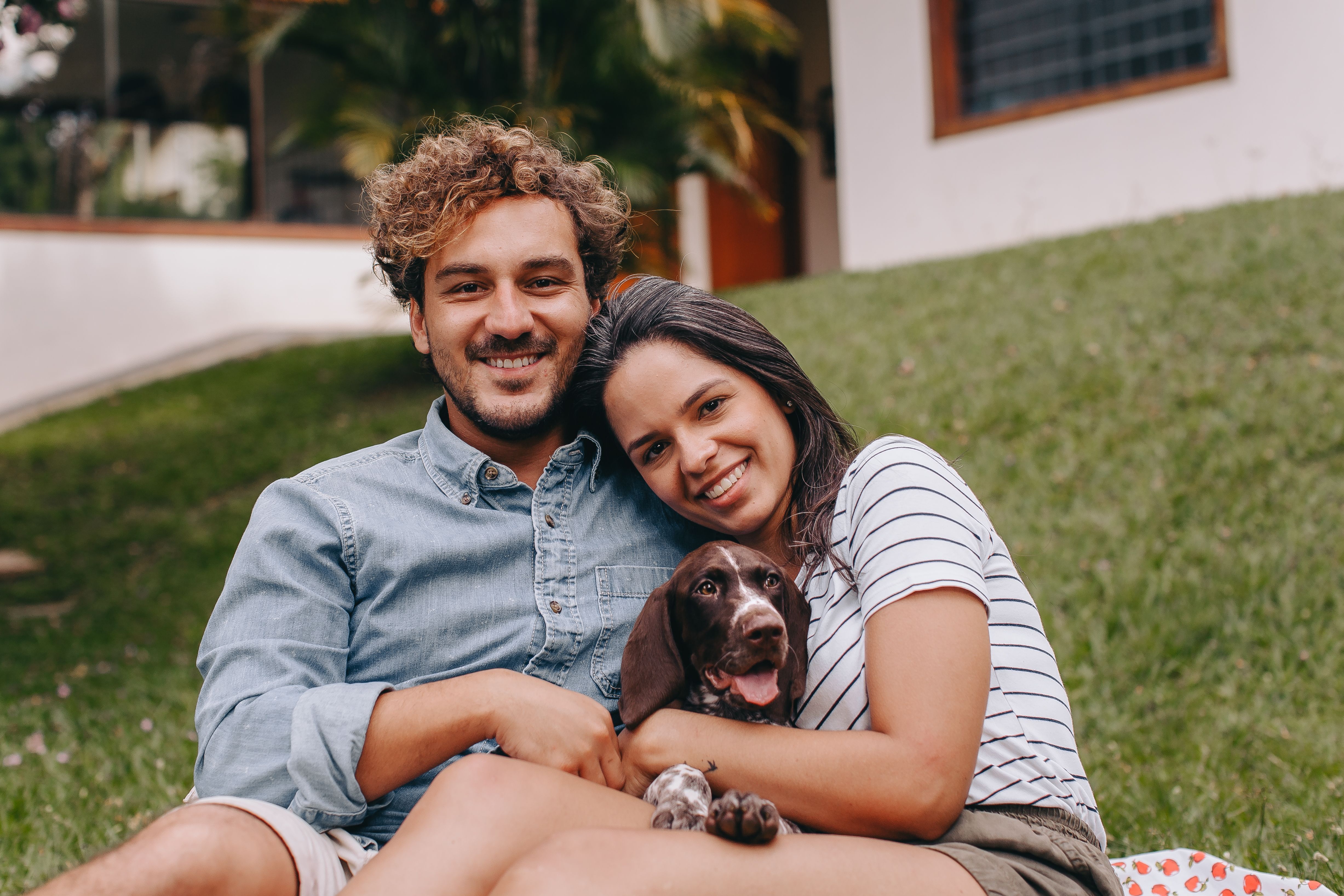 Portrait of Smiling Couple with Dog · Free Stock Photo