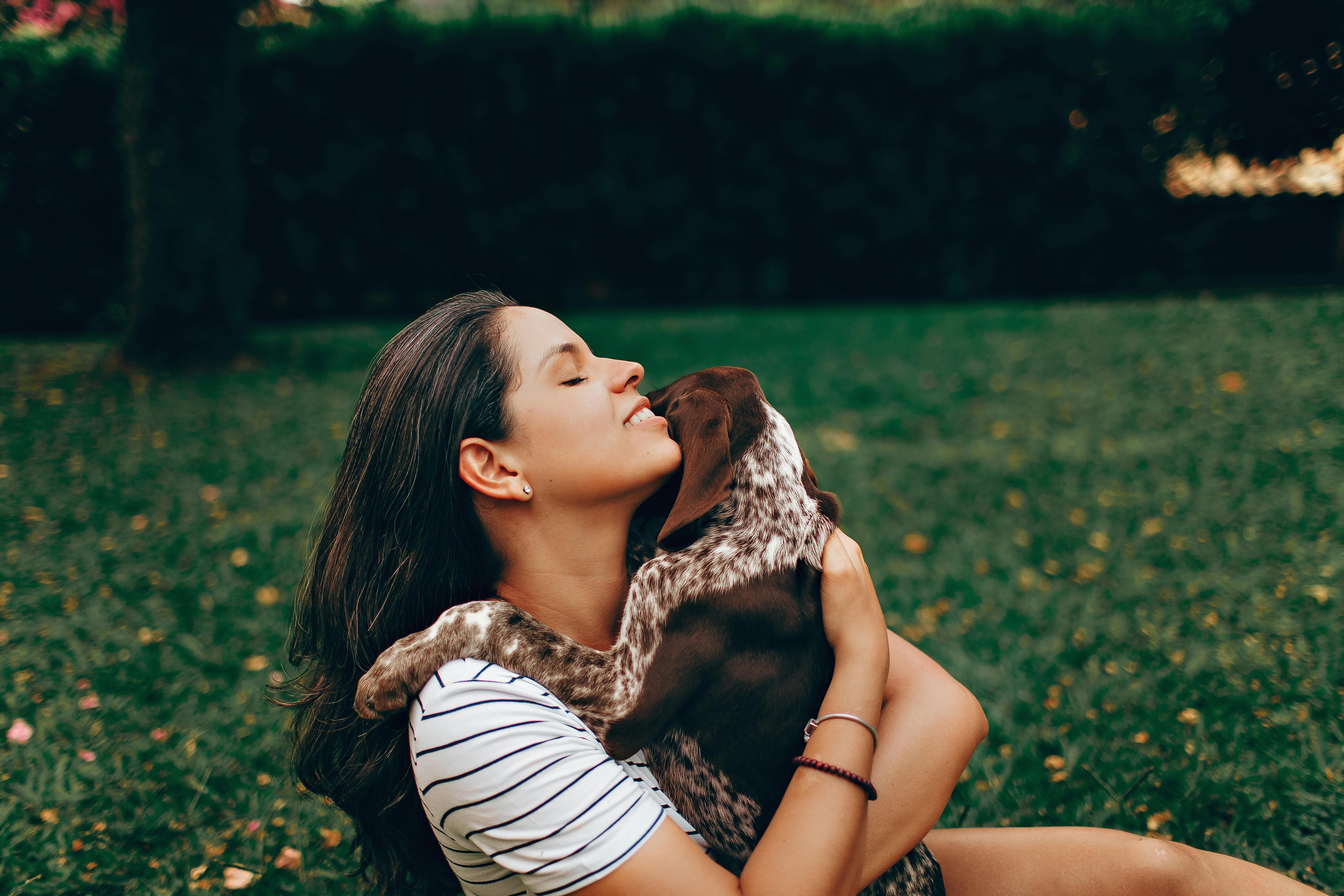 smiling woman with her pet