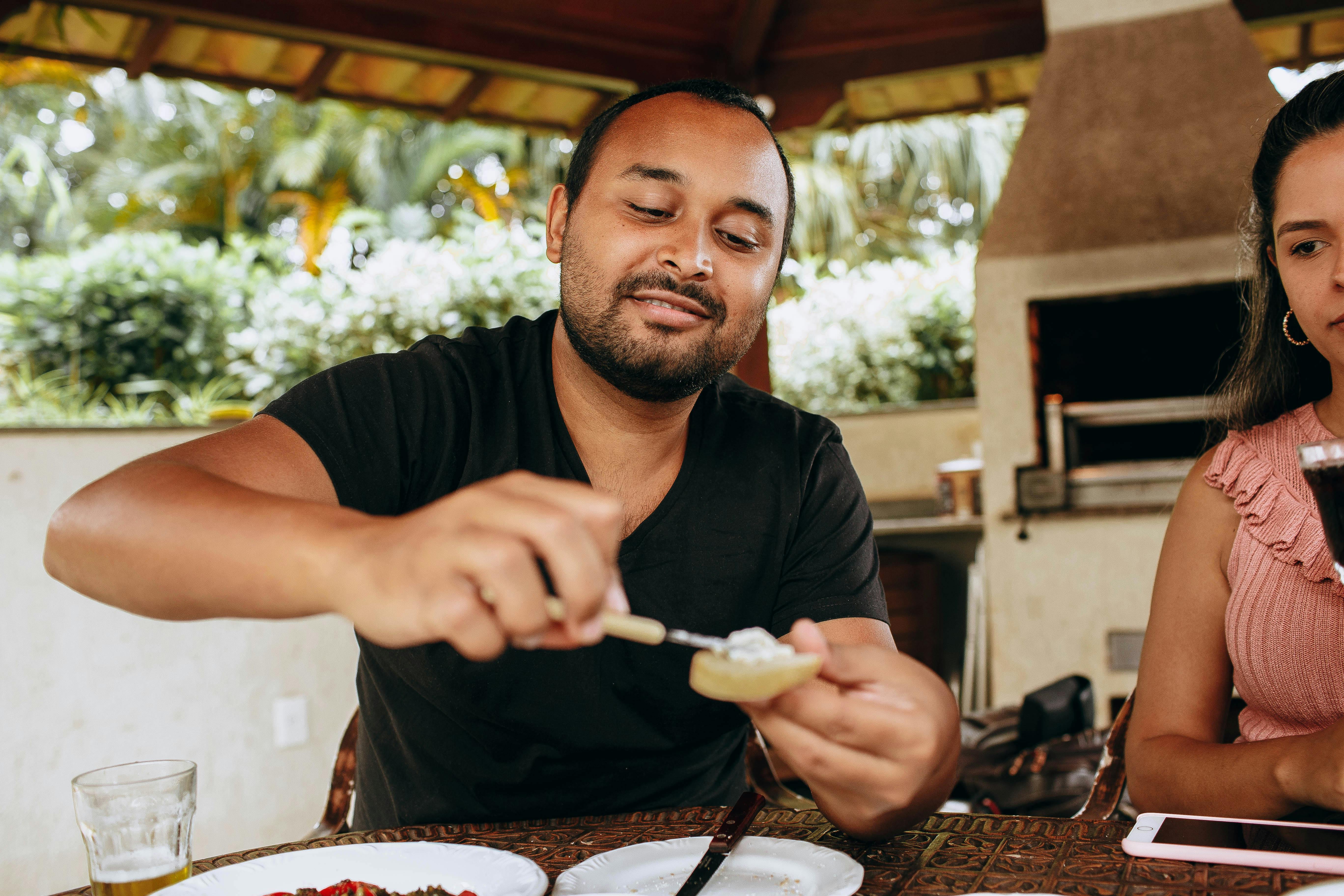 Happy couple enjoying toast at breakfast