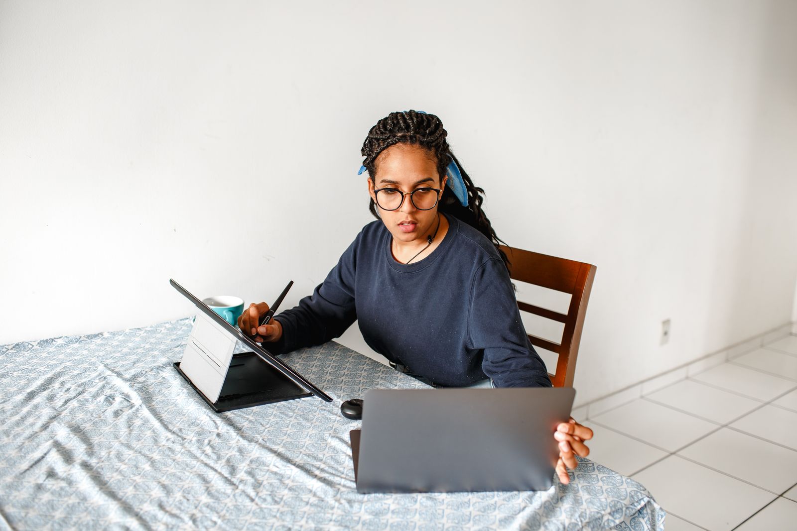 Woman working with a laptop and tablet