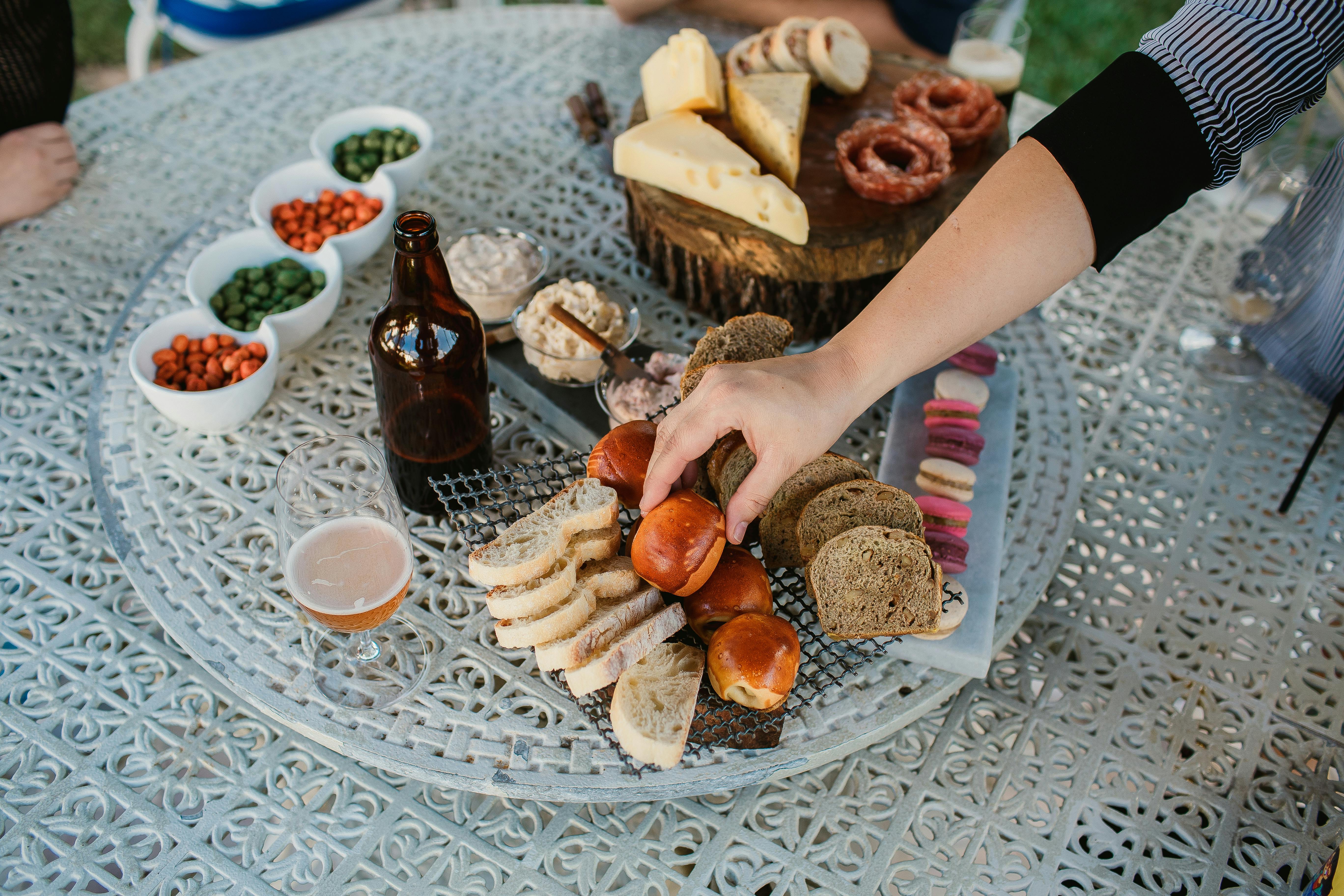 Food spread and drinks laid out for a party catering event