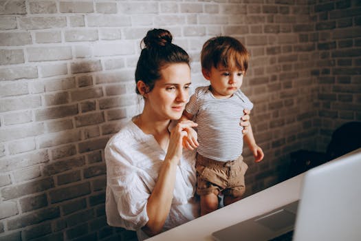 Mother and child engaged with a laptop in a cozy home setting, fostering connection and learning.