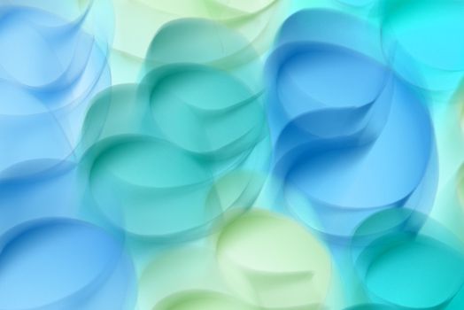Colorful abstract image with overlapping shapes in vibrant blue and green hues, perfect for backgrounds and design work.