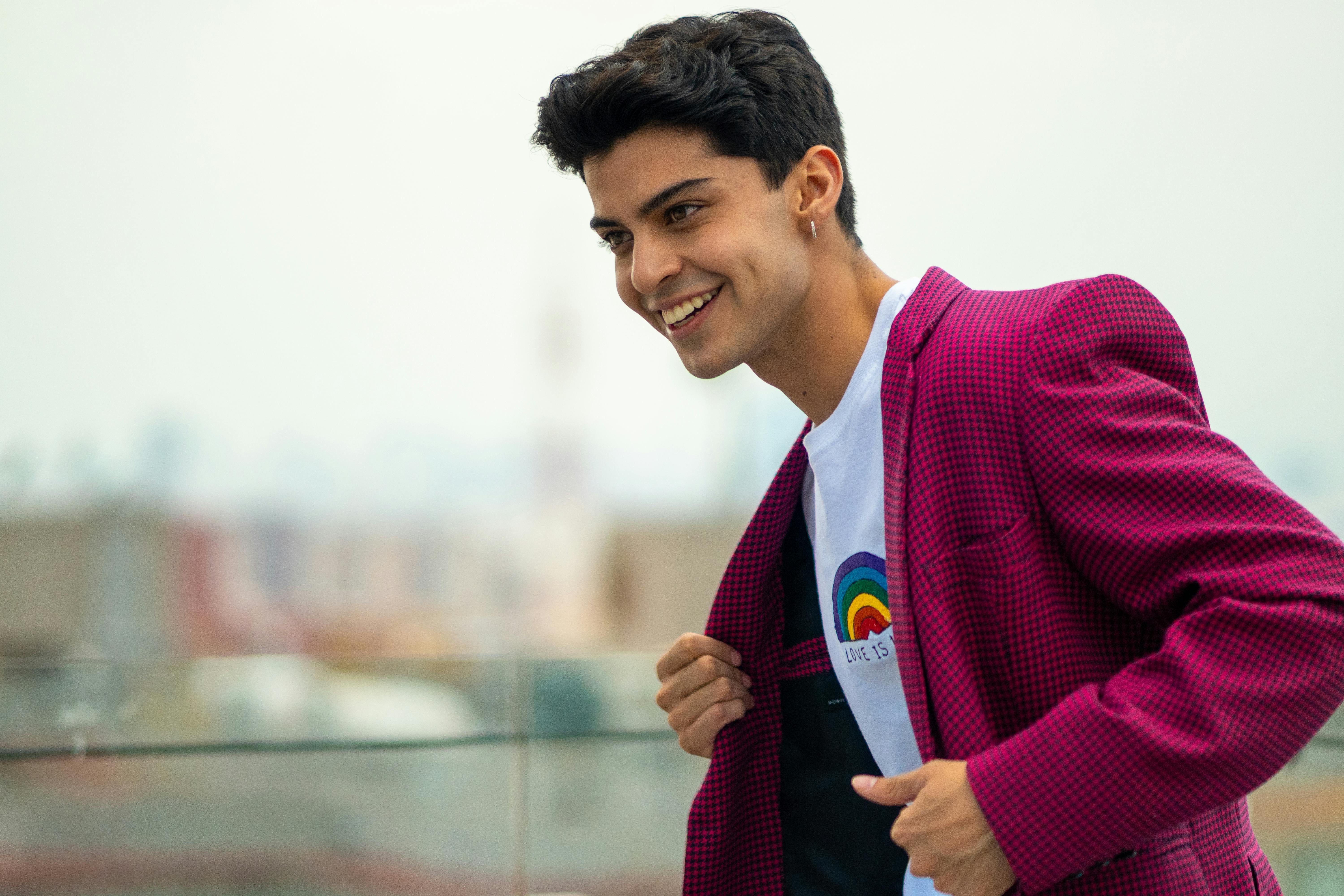 cheerful model in red jacket and white t shirt