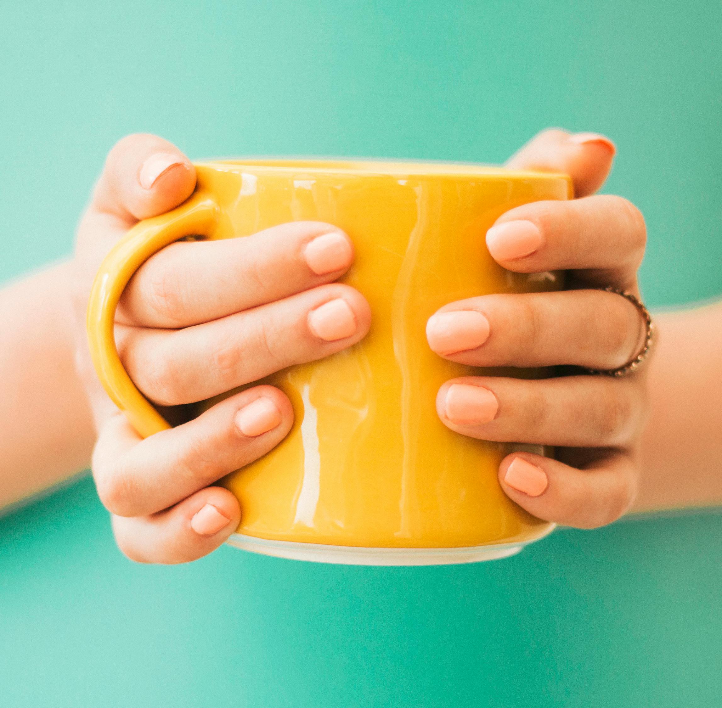 Person Holding Mug