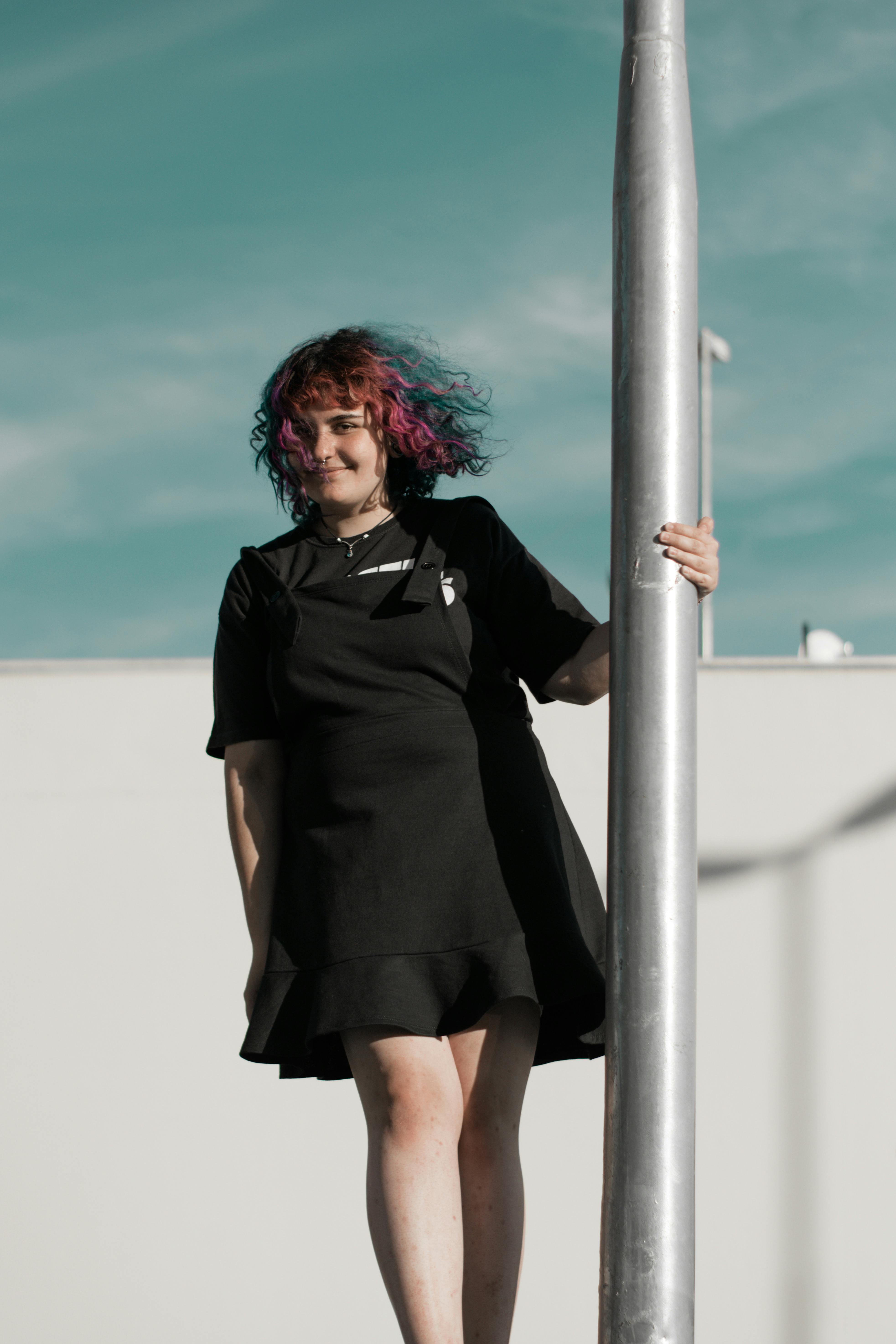 little black dress dressed down with boots and tights