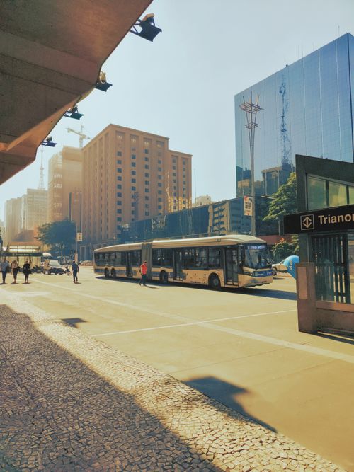 Free Vibrant Sao Paulo city street showcasing public transit and modern buildings under bright daylight. Stock Photo