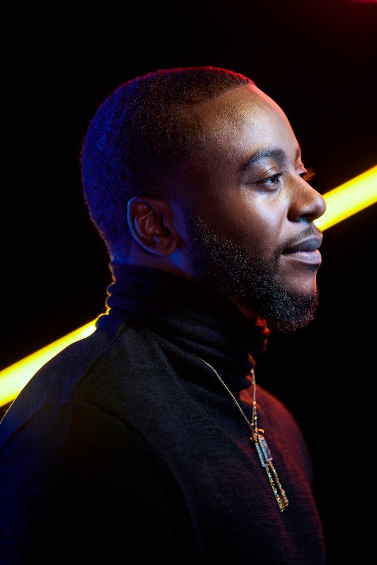 Side View Photo Of Man Wearing Black Turtleneck Shirt