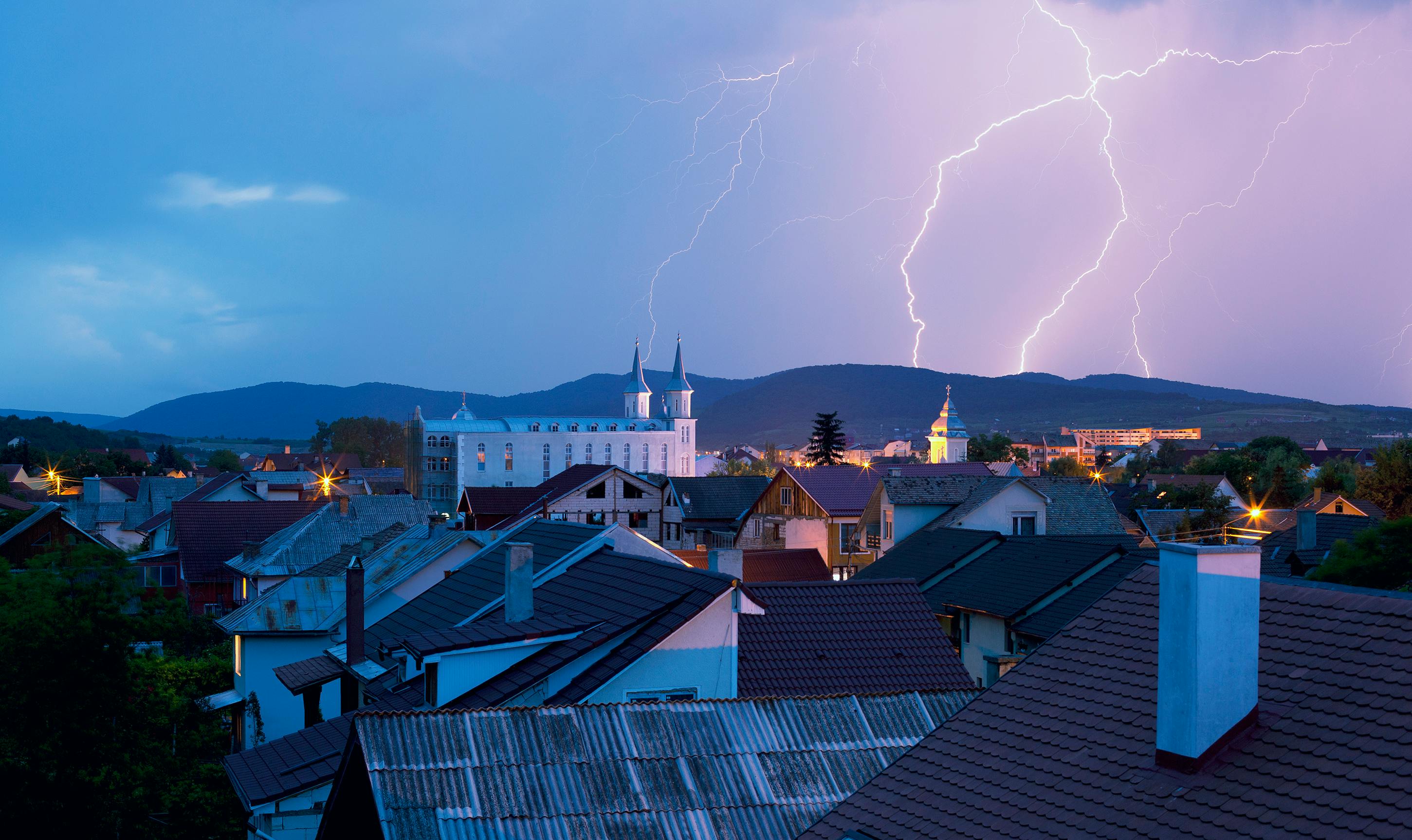 lightning in sky over town