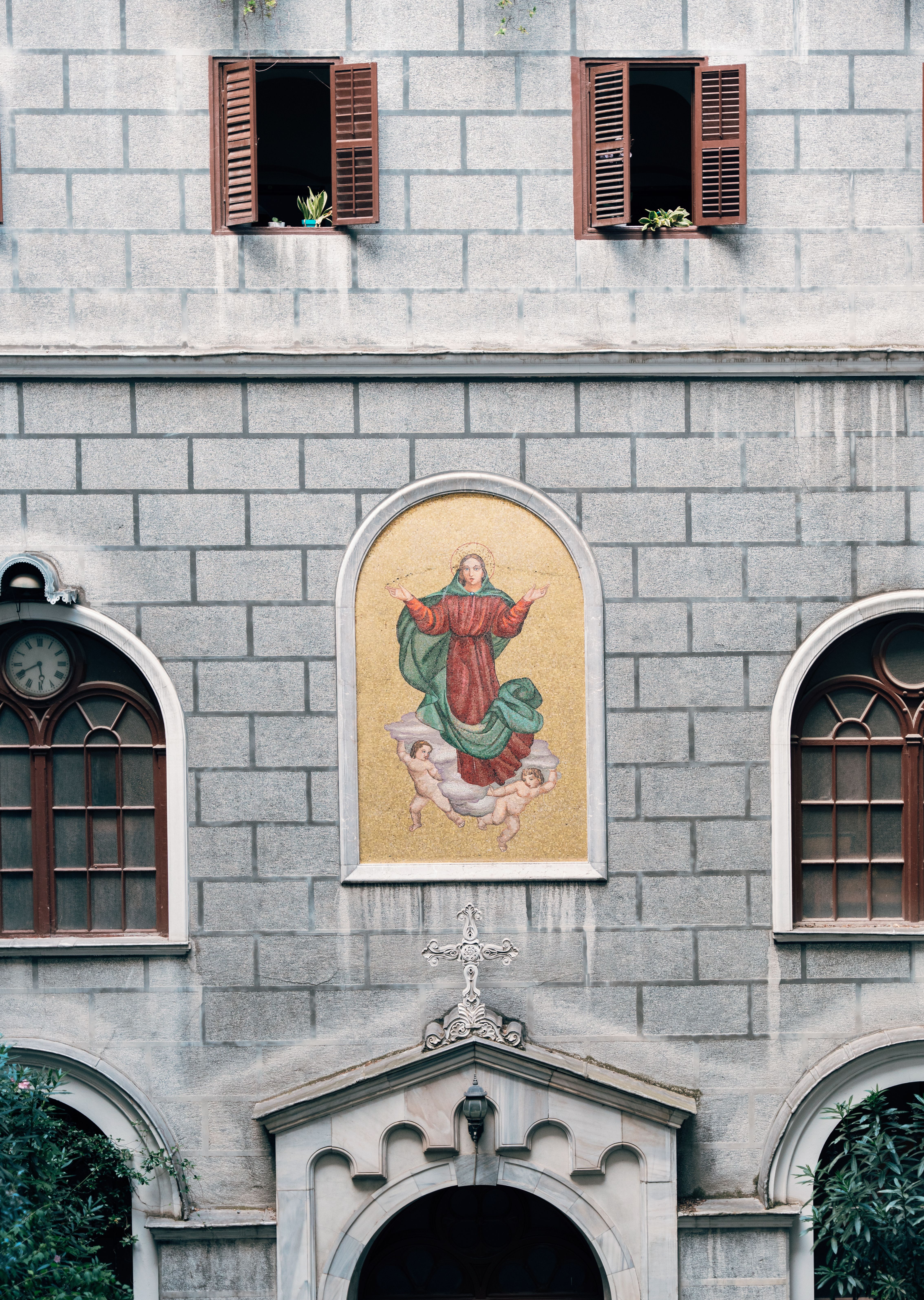 A building with a painting of a saint on it · Free Stock Photo