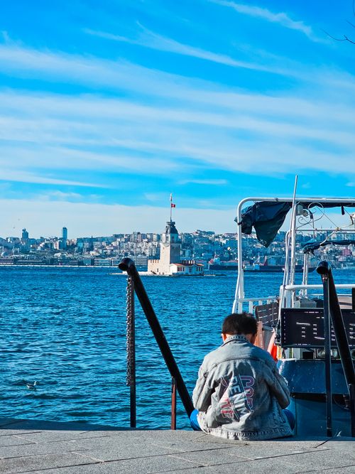 Free Explore the stunning view of Maiden's Tower from Üsküdar pier with vibrant cityscapes and serene waters. Stock Photo