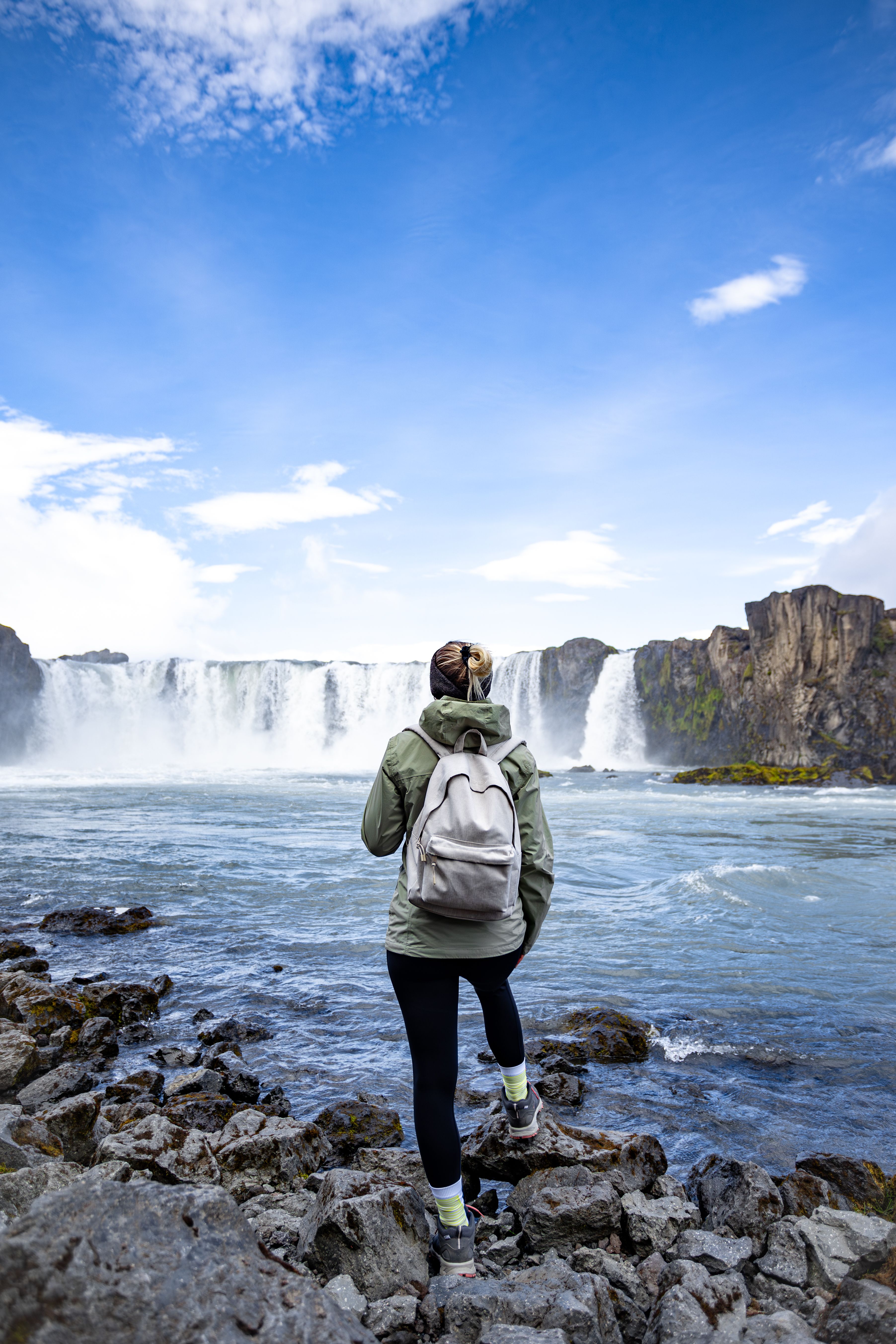 Woman in Jacket Standing near Waterfall · Free Stock Photo