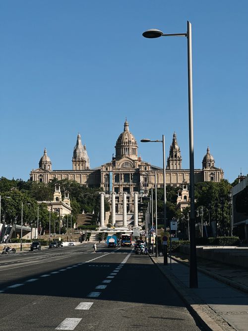 Free Street view with the National Art Museum of Catalonia in Barcelona under a clear blue sky. Stock Photo