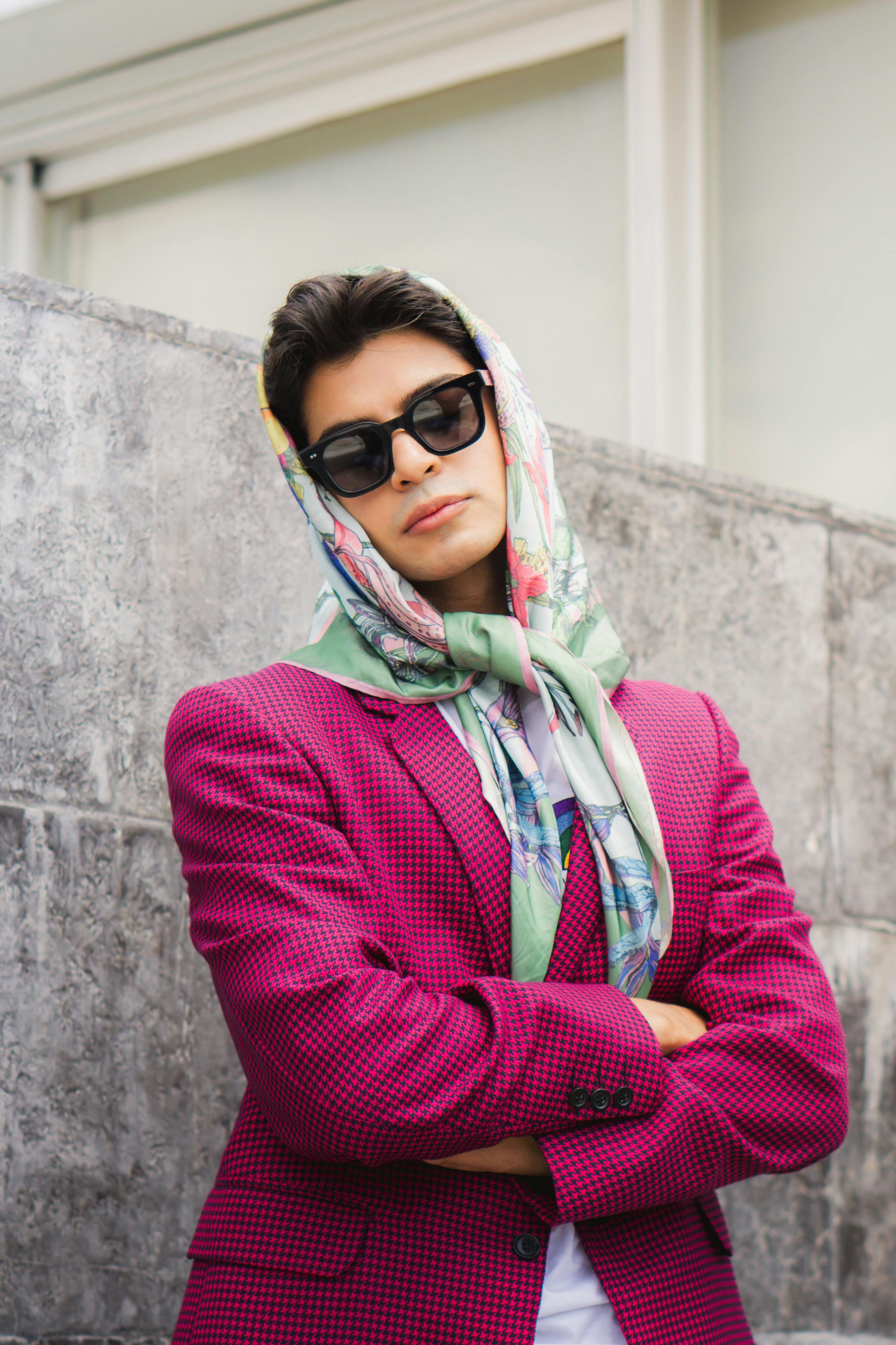 Fashionable young adult in vibrant outfit and scarf posing outdoors in Mexico City, CDMX.