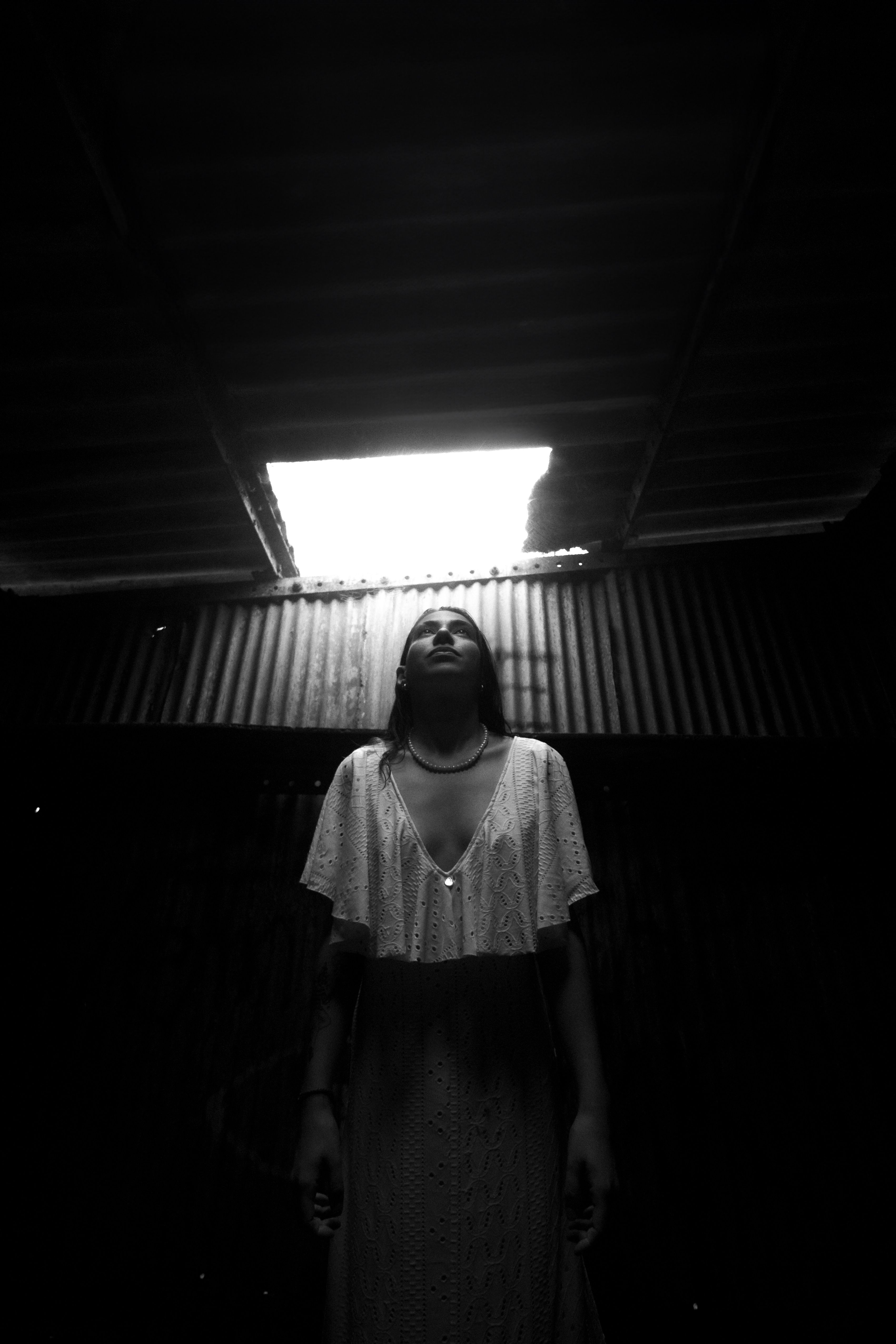 A Woman Standing in a Dark Room · Free Stock Photo