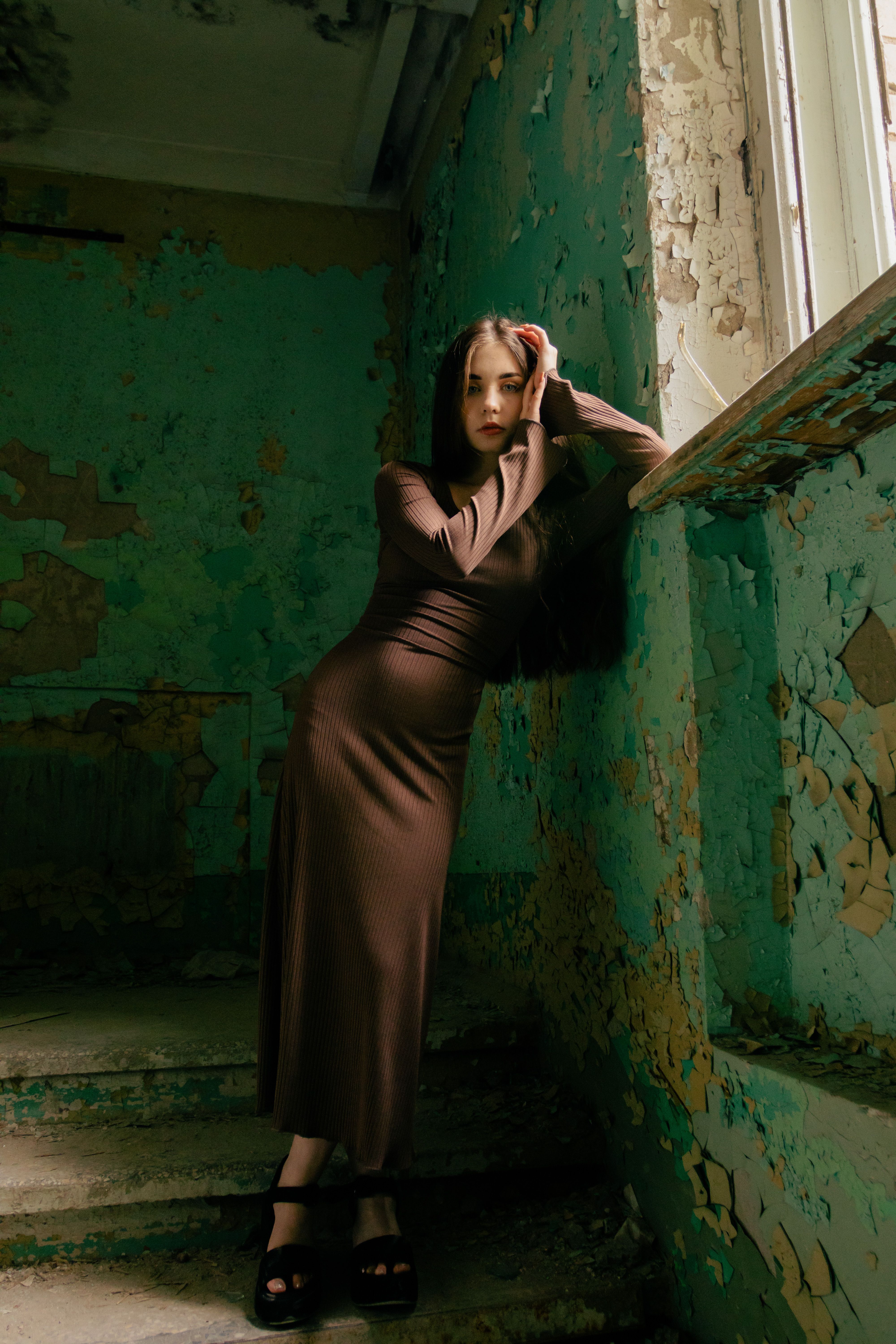 Woman in chocolate brown ribbed knit dress