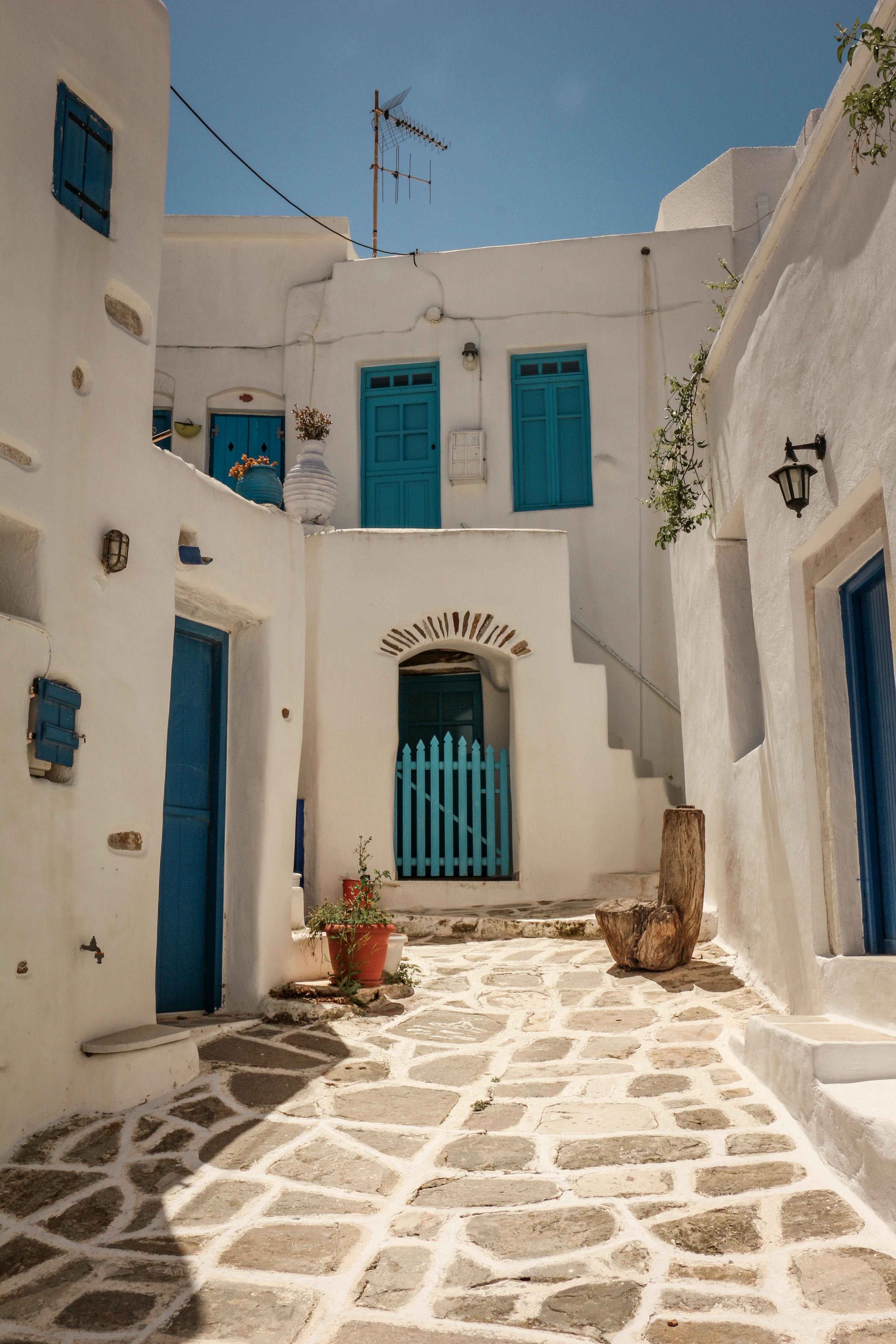 Traditional Greek architecture with blue accents in Paros, perfect for travel and vacation themes.