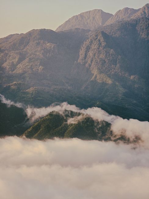 Captivating mountain landscape with clouds in Lao Cai, Vietnam.
