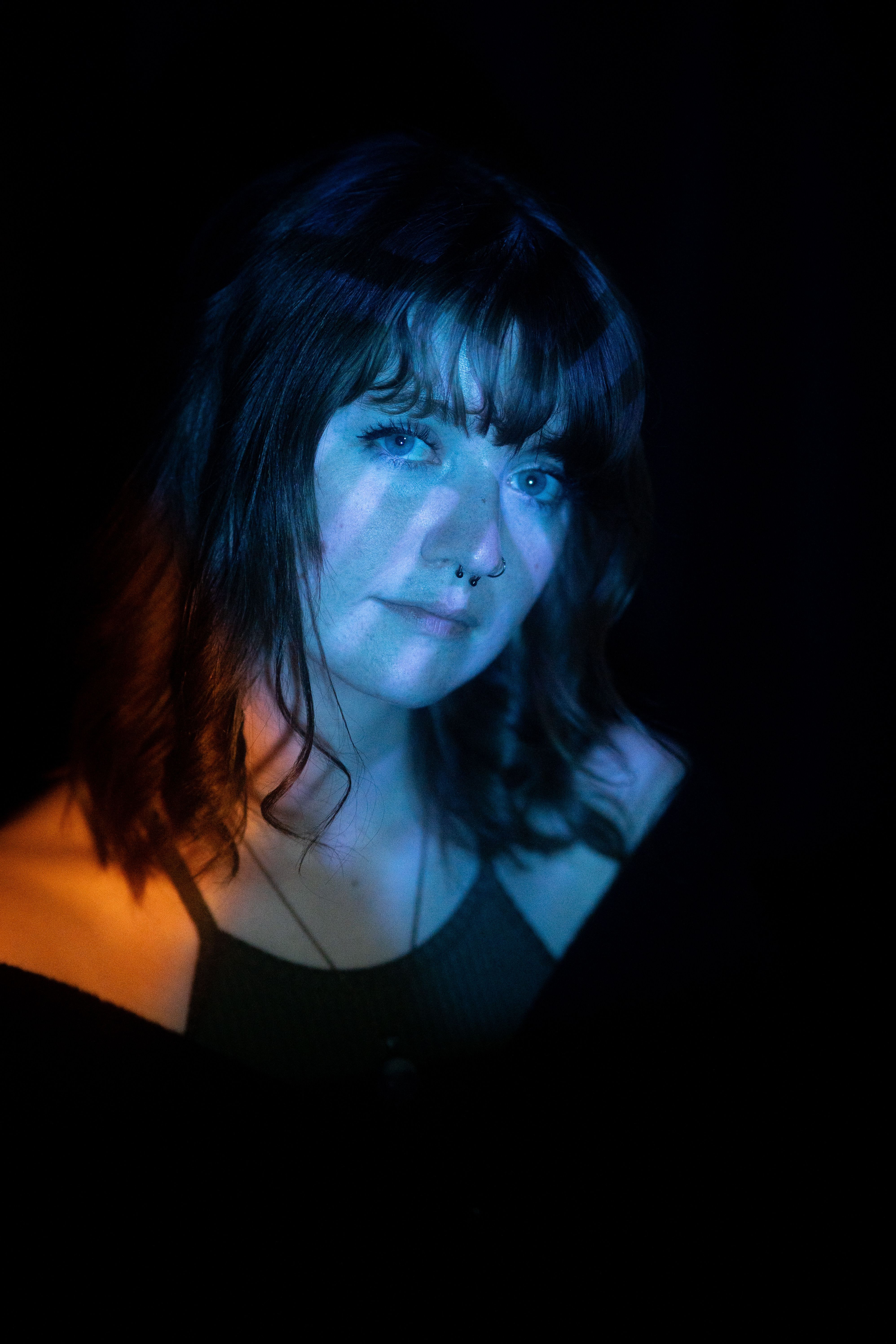 A woman with dark hair and blue eyes · Free Stock Photo