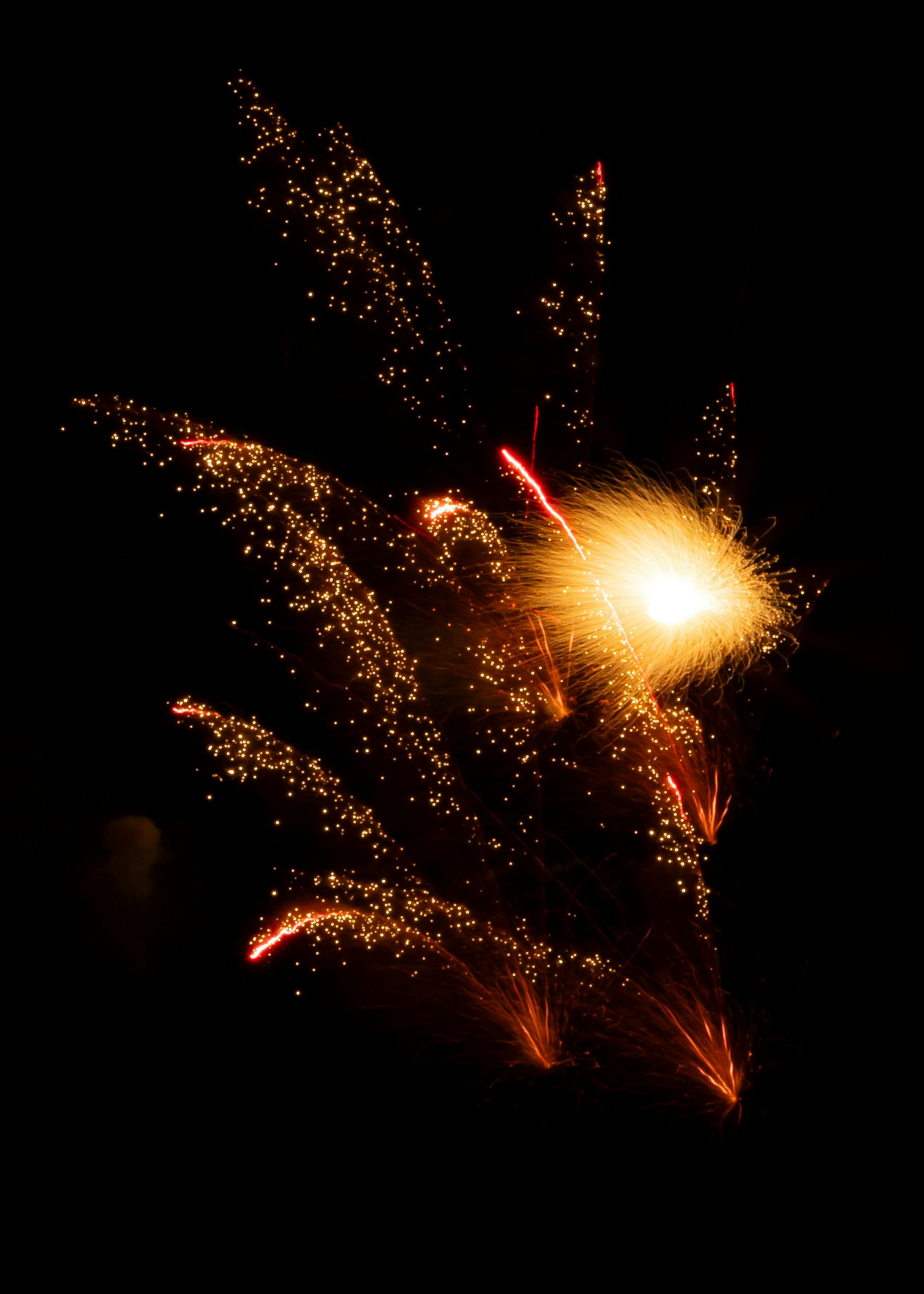 Vivid fireworks explosion in the night sky, capturing a moment of celebration and brightness.